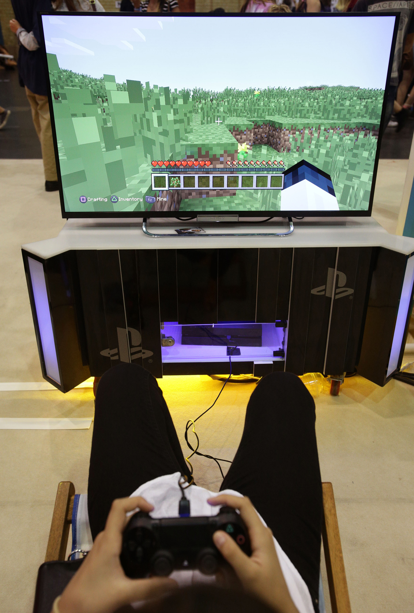 A visitor playing a game of Minecraft at the Summer in the City festival, the UK's largest YouTube community event at Alexandra Palace in London, Aug. 9, 2014.