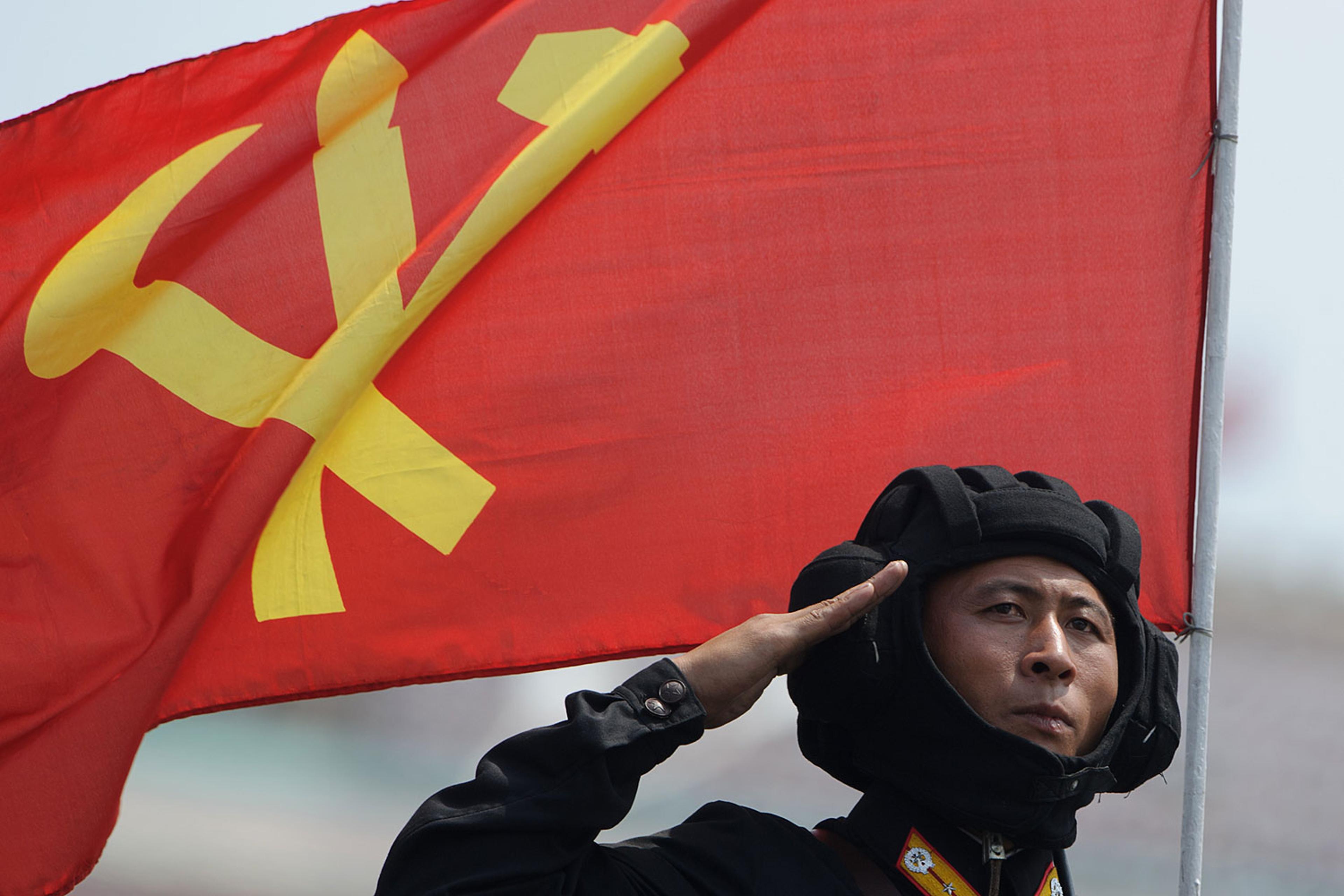 In a photo taken on July 27, 2013 a North Korean soldier salutes during a march through Kim Il-Sung square at a military parade marking the 60th anniversary of the Korean war armistice in Pyongyang