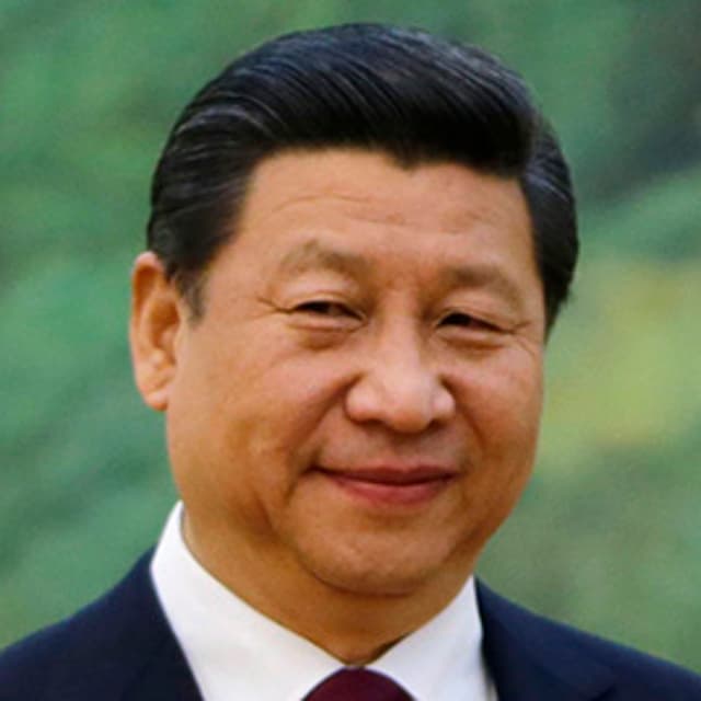 China's President Xi attends a meeting with former U.S. President Clinton at the Great Hall of the People, in Beijing