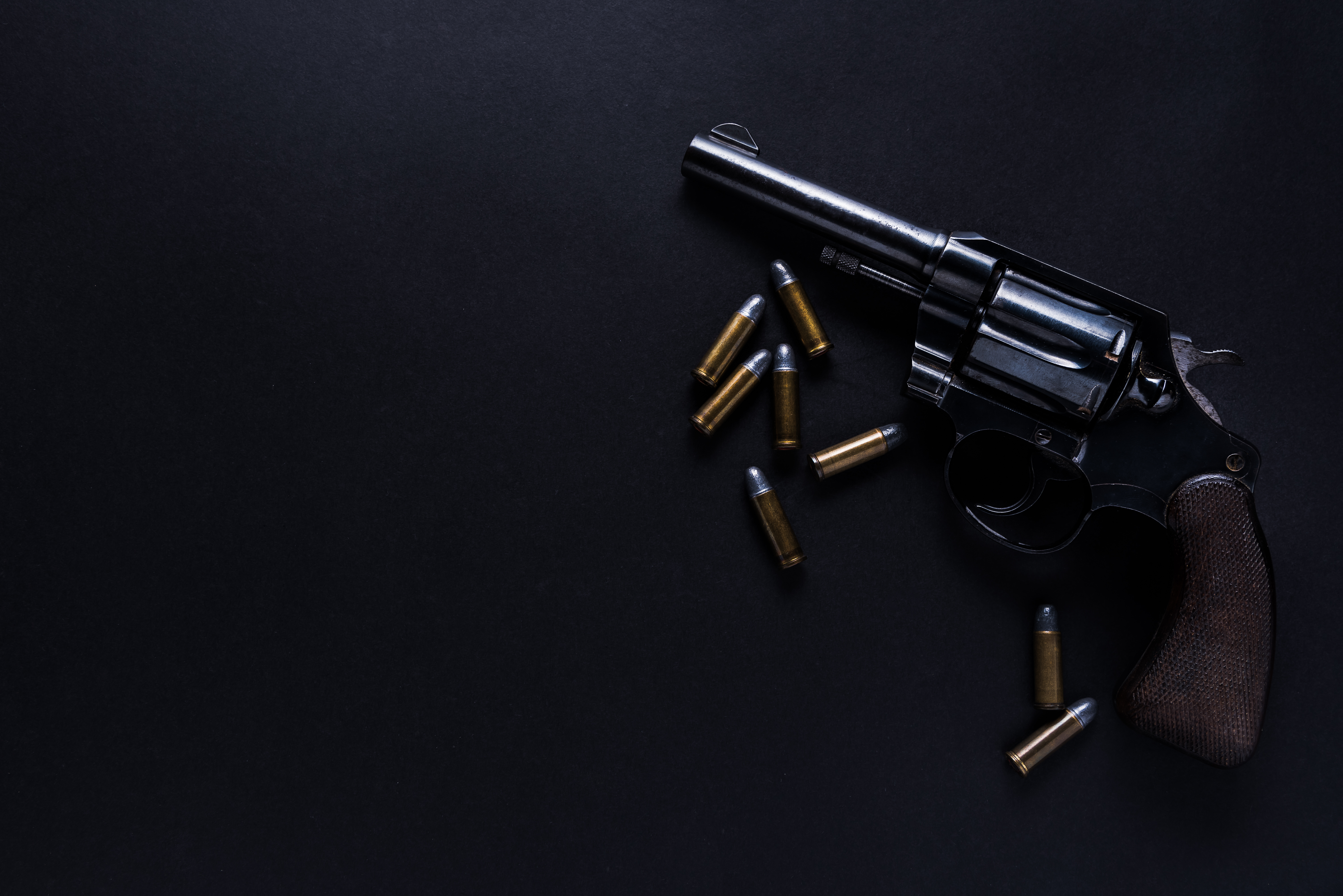 Directly Above Shot Of Handgun And Bullets On Table