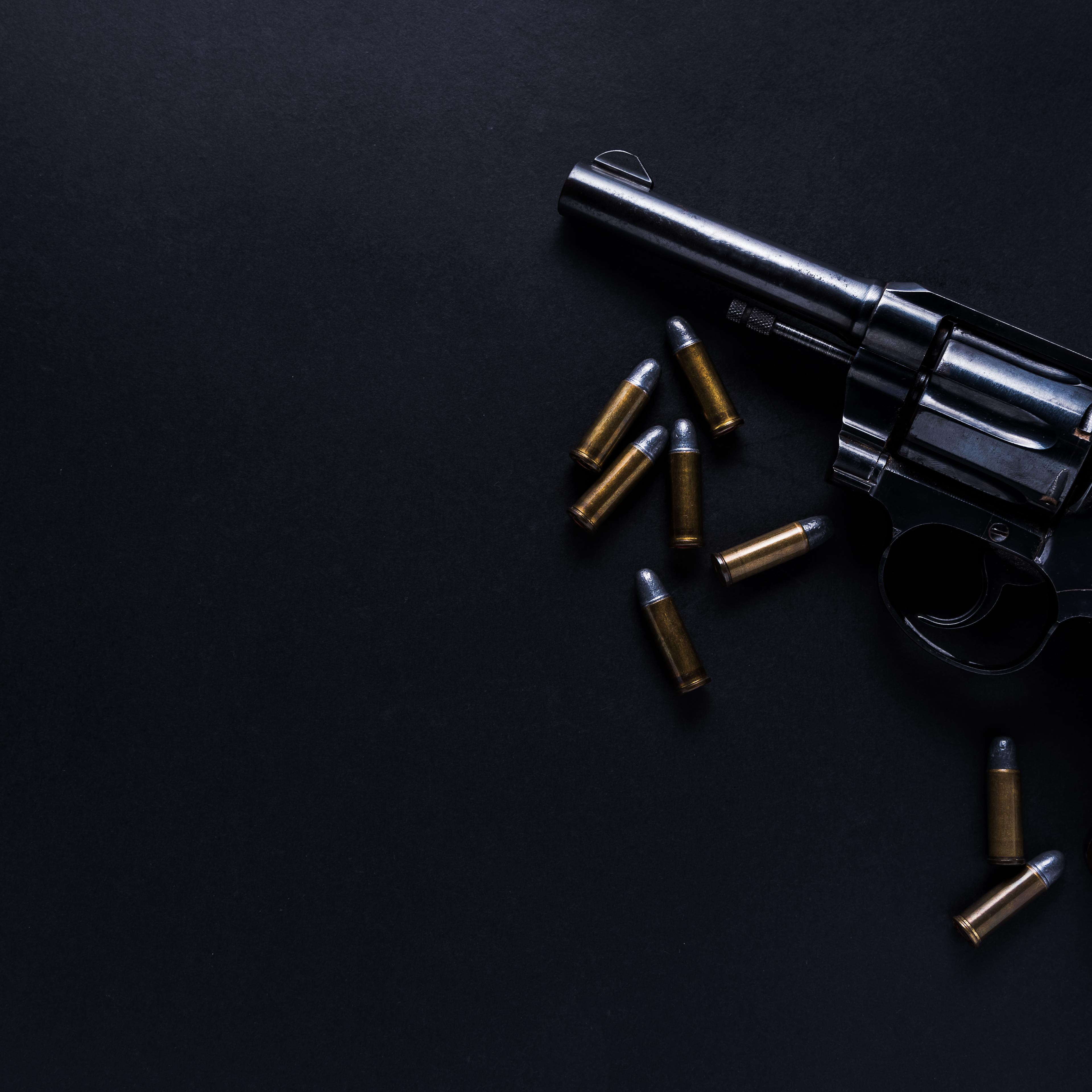Directly Above Shot Of Handgun And Bullets On Table