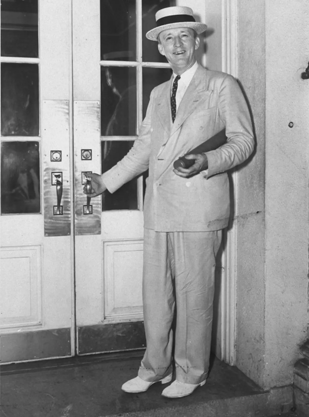 Supreme Court Justice Hugo L. Black standing w. ha