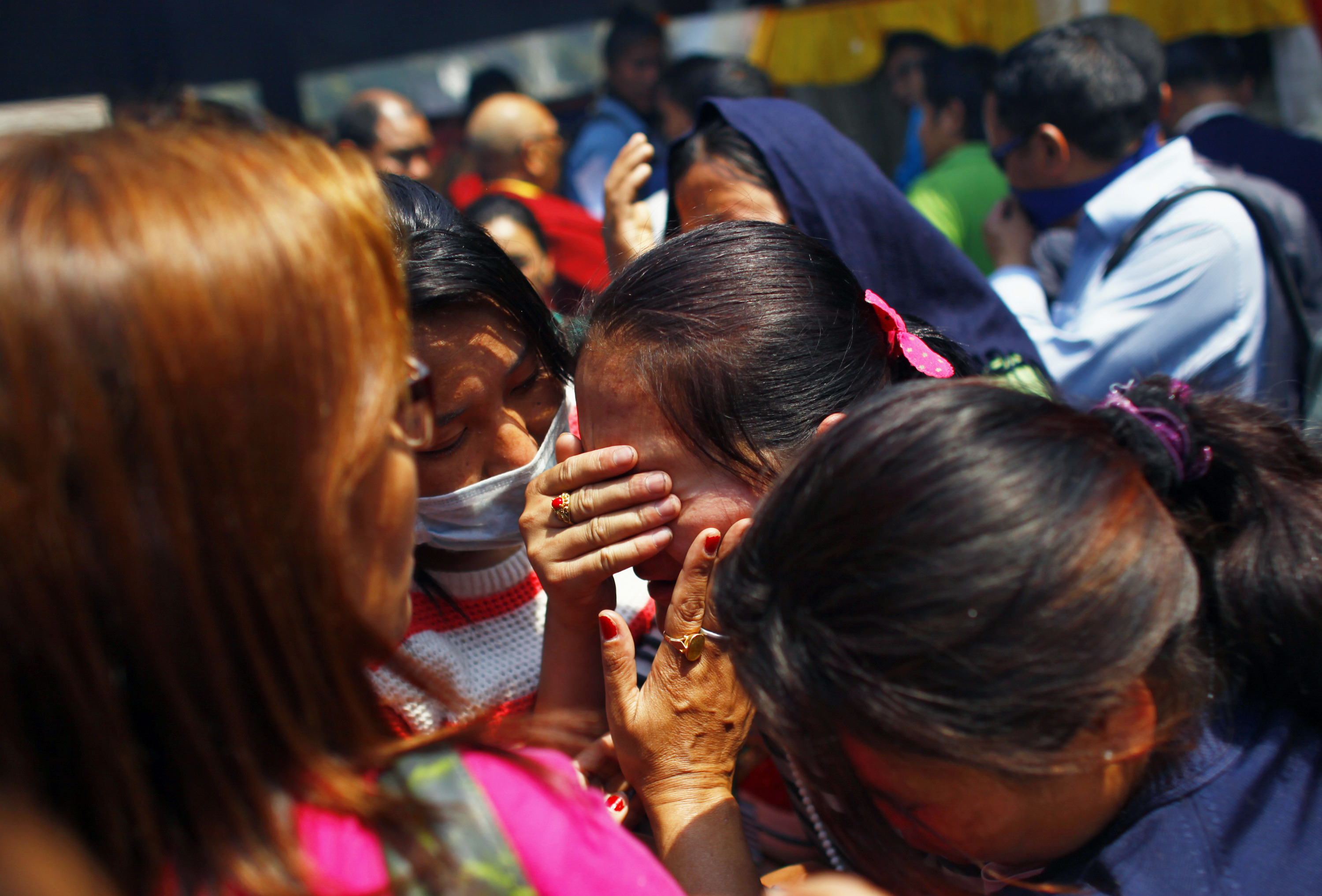 Relatives of mountaineers, killed in an avalanche on Mount Everest, cry during the funeral ceremony in Katmandu, Nepal on April 21, 2014.