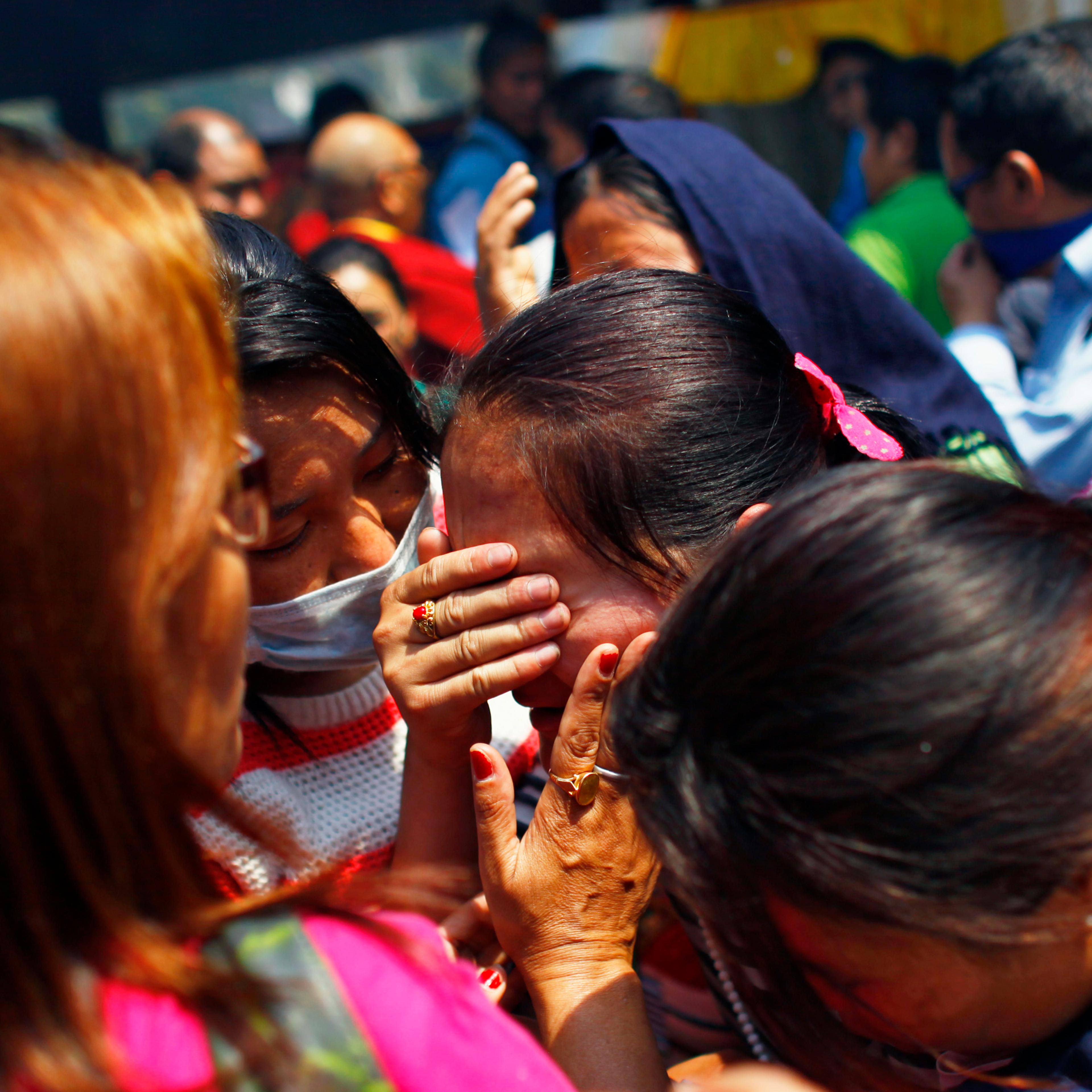 Relatives of mountaineers, killed in an avalanche on Mount Everest, cry during the funeral ceremony in Katmandu, Nepal on April 21, 2014.