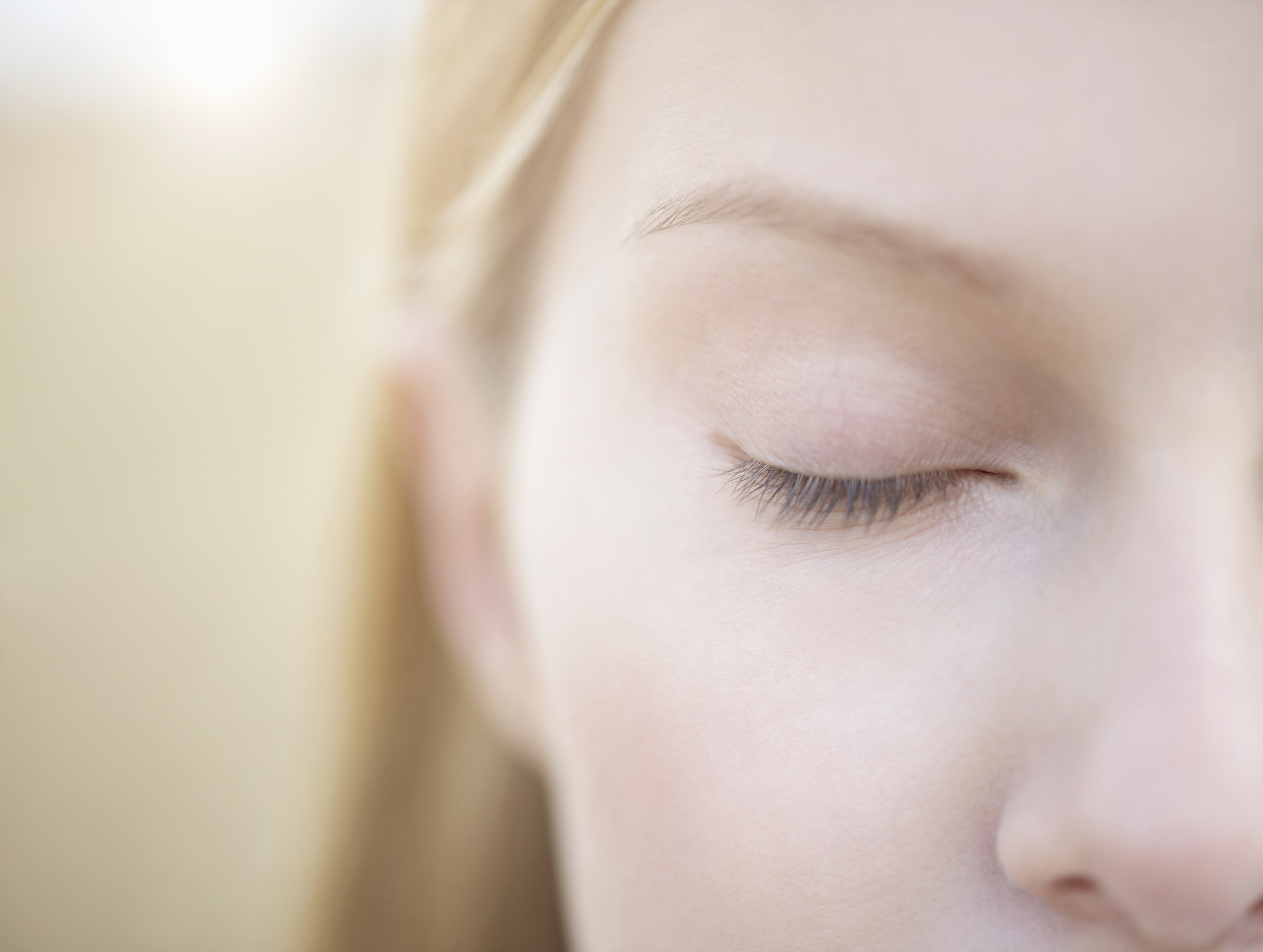 Close up of woman with eye closed.