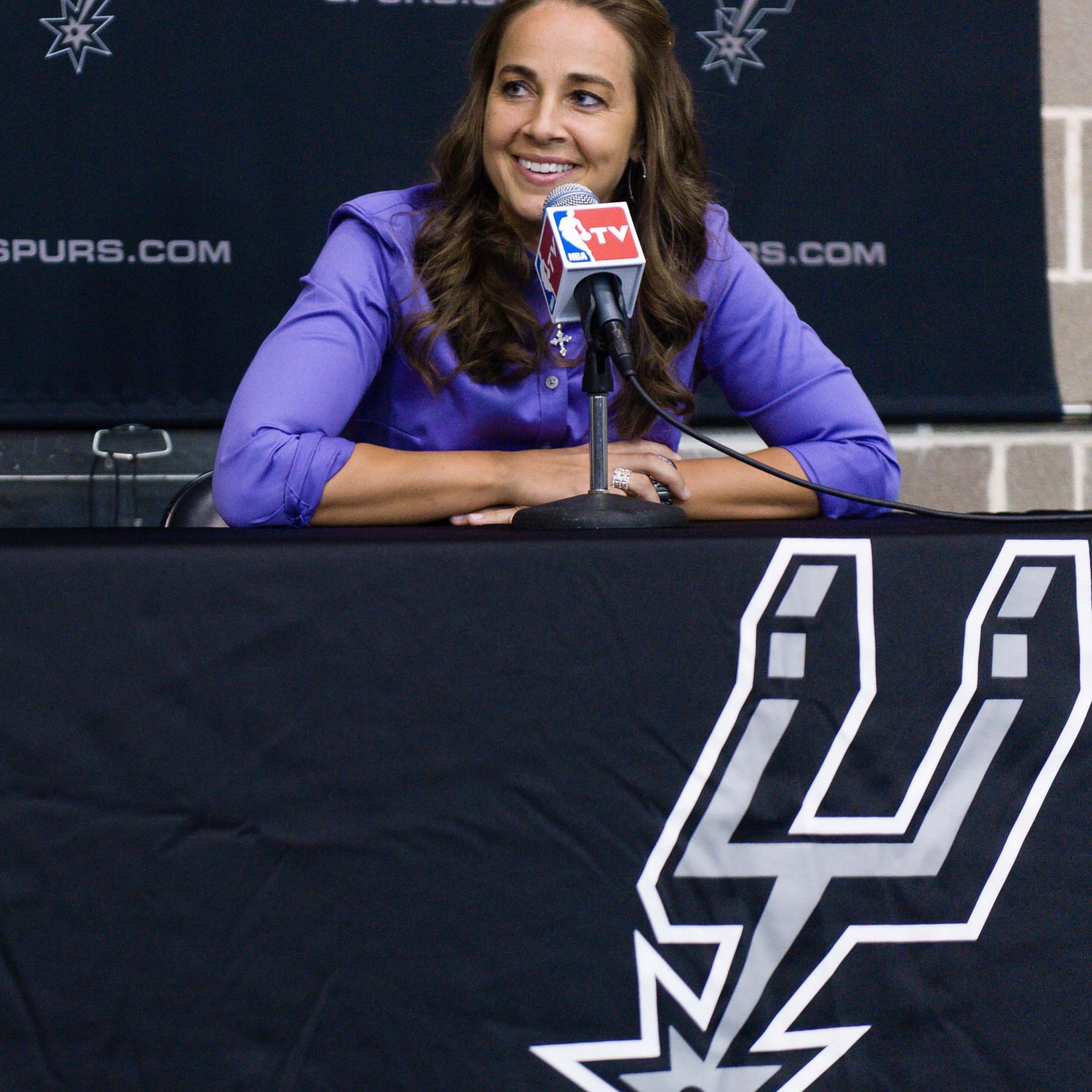 WNBA star Becky Hammon takes questions from the media at the San Antonio Spurs practice facility after being introduced as an assistant coach with the team on Tuesday, Aug. 5, 2014 in San Antonio.