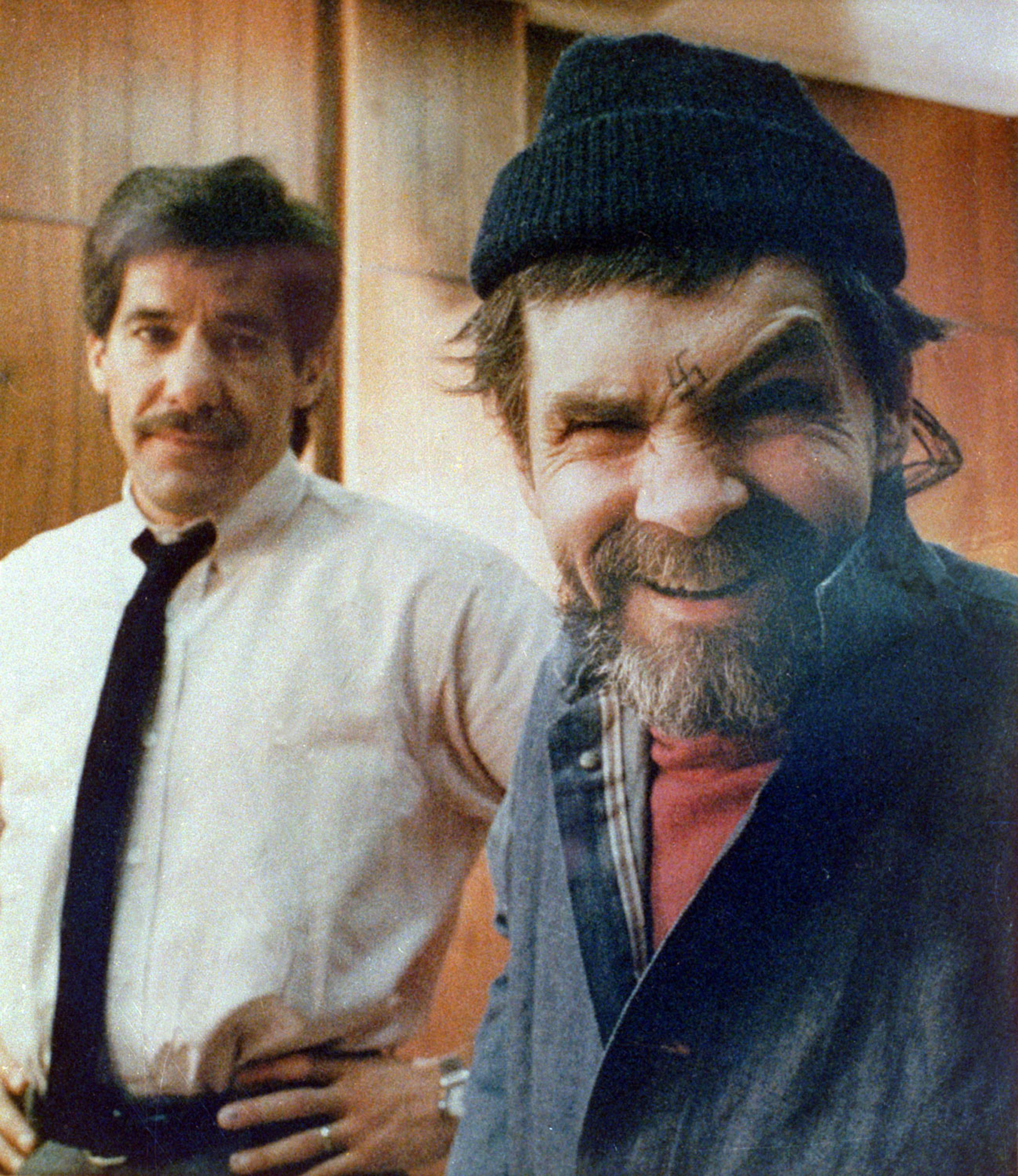 Manson mugs for the camera during a rare interview with reporter Geraldo Rivera at San Quentin Prison in California on March 17, 1988.