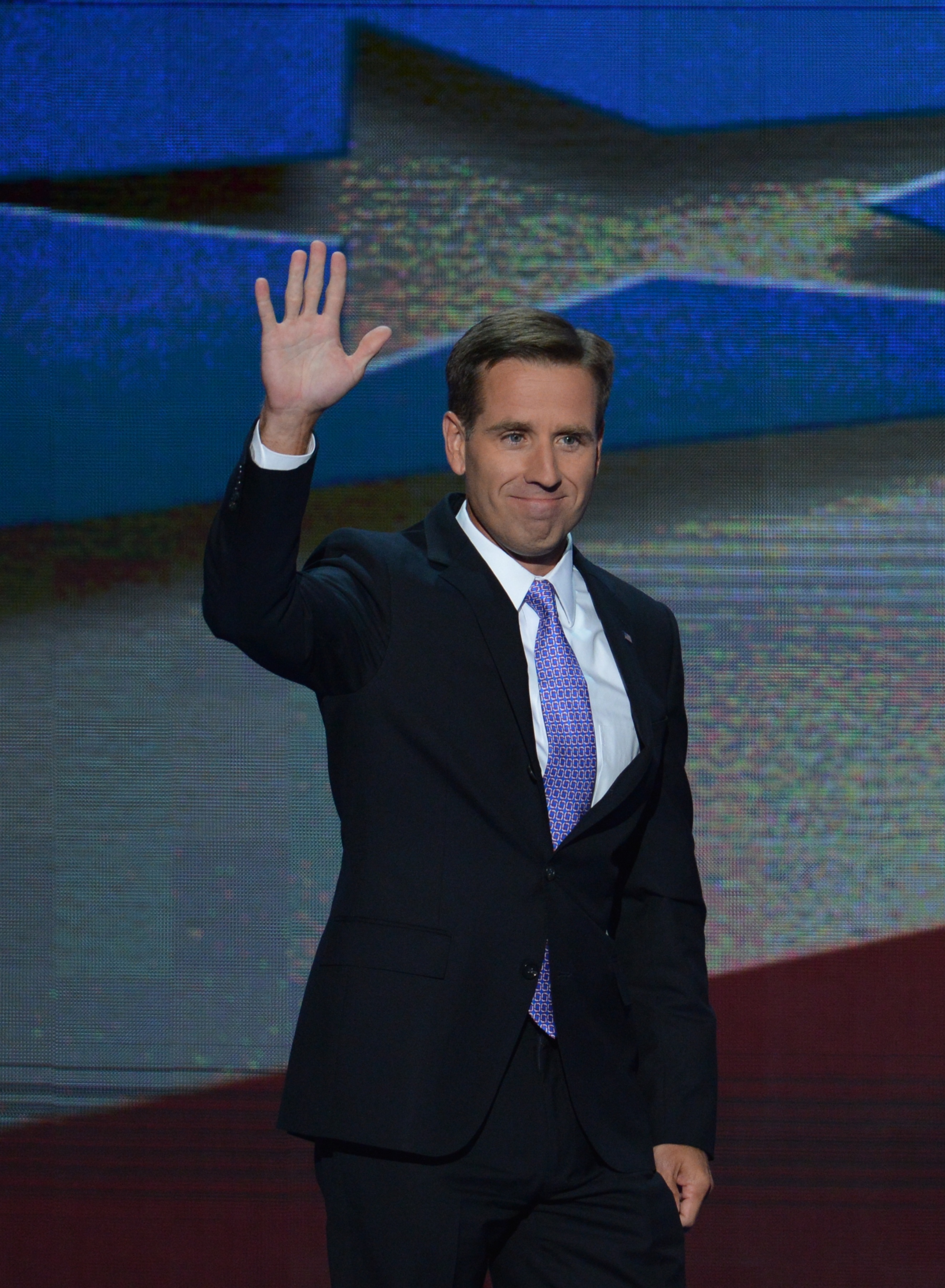 Attorney General of Delaware and son of Vice President Joe Biden, Beau Biden, waves to the audience at the Time Warner Cable Arena in Charlotte, North Carolina, on September 6, 2012 on the final day of the Democratic National Convention.