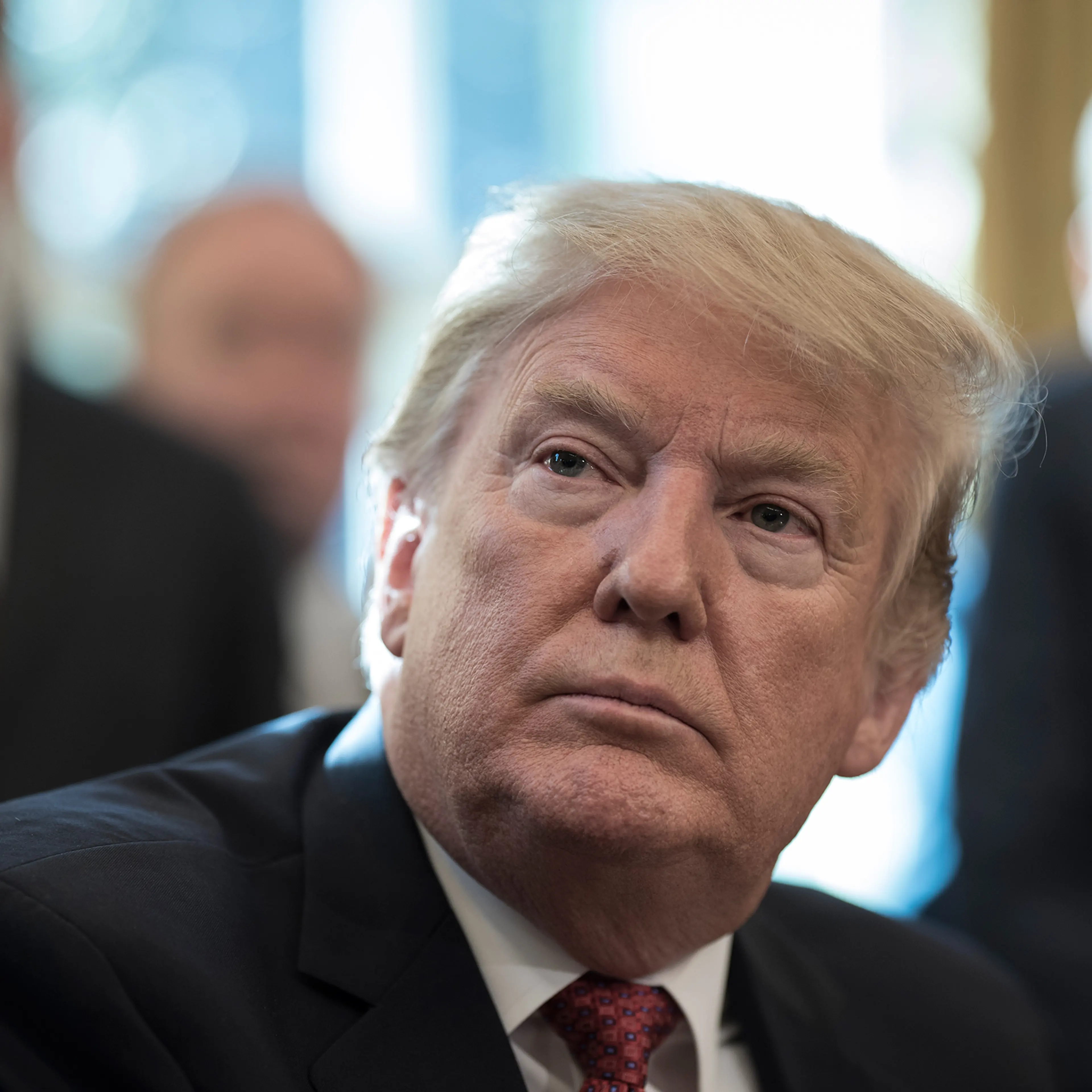 President Donald Trump speaks with reporters in the White House.