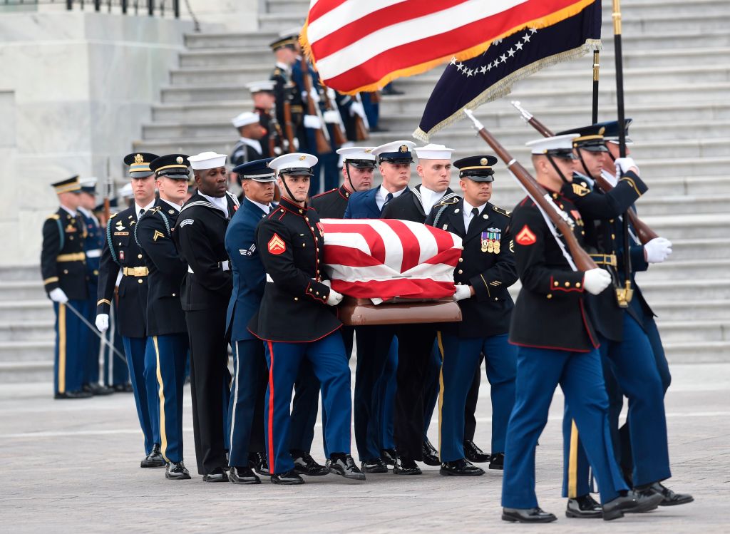 The casket with the remains of former US President George H.W. Bush departs the US Capitol