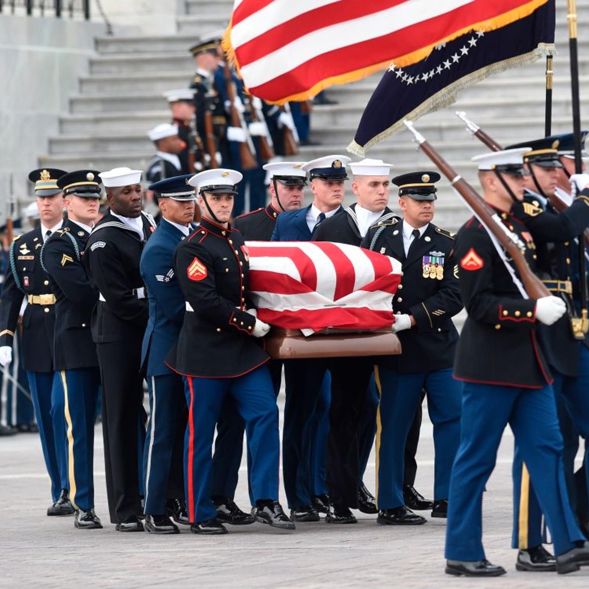 The casket with the remains of former US President George H.W. Bush departs the US Capitol