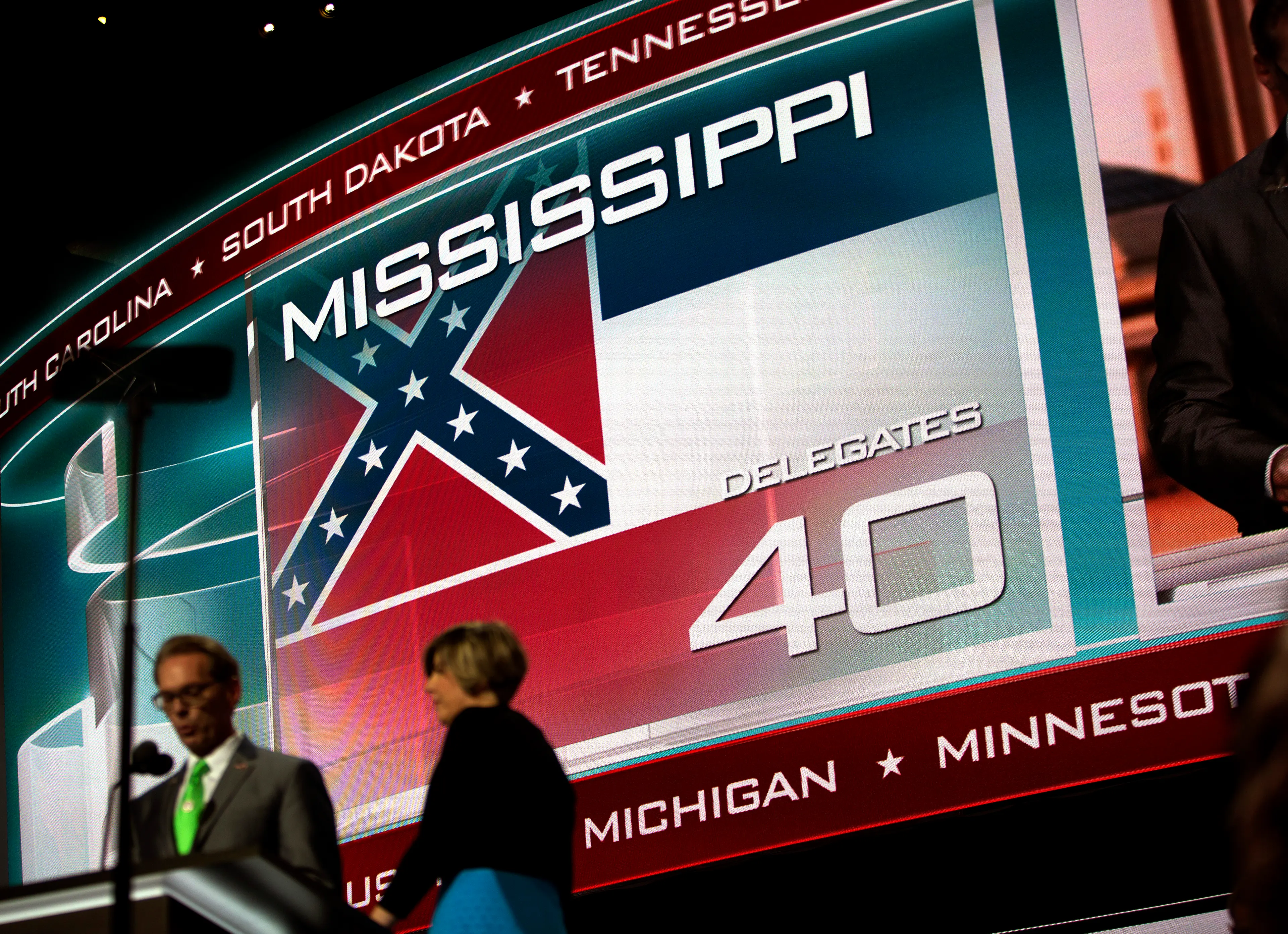 A screen displays the state flag of Mississippi, the only state that includes the Confederate battle emblem in its official state flag, at the Republican National Convention in Cleveland on Tuesday, July 19, 2016.