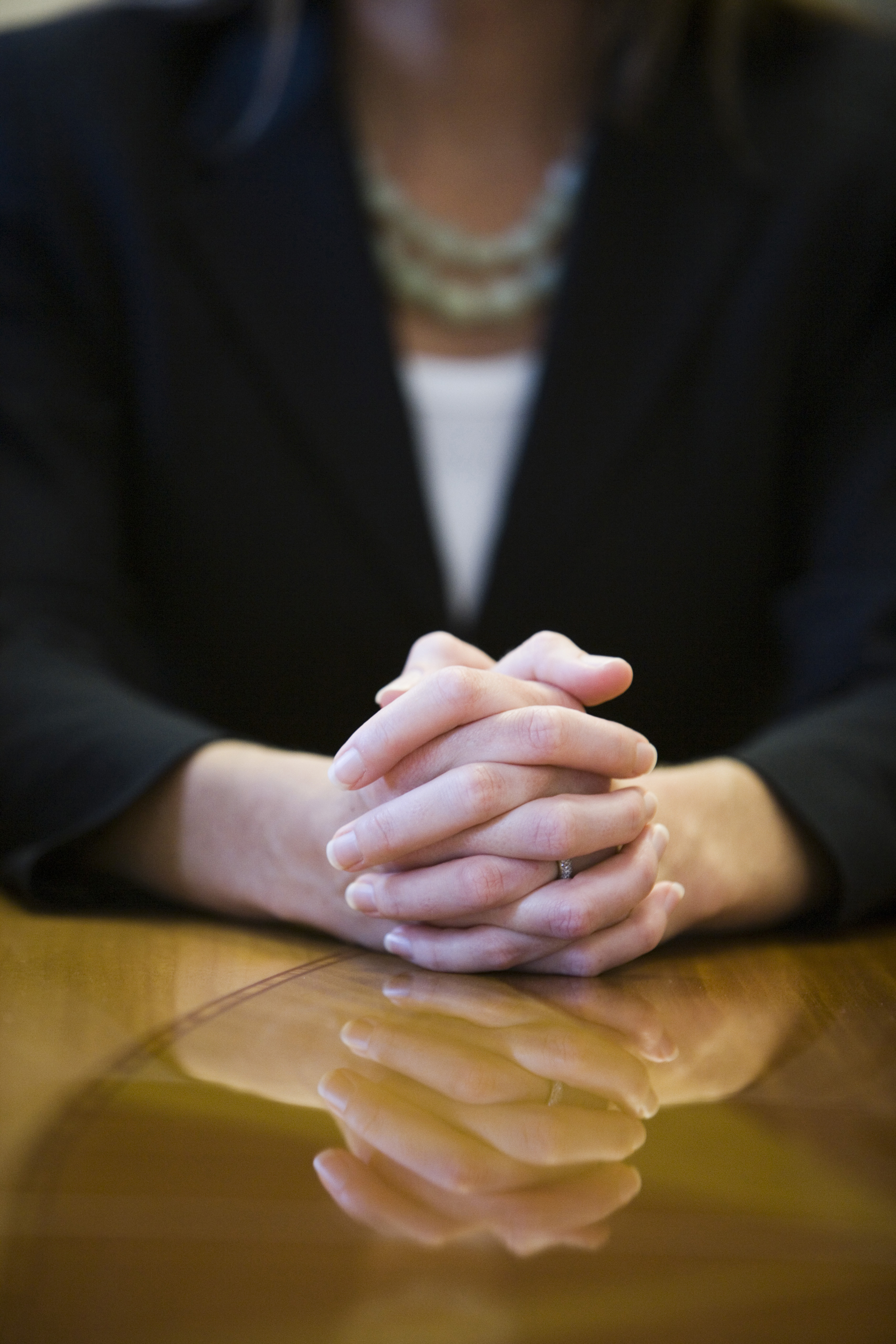businesswoman-hands-clasped