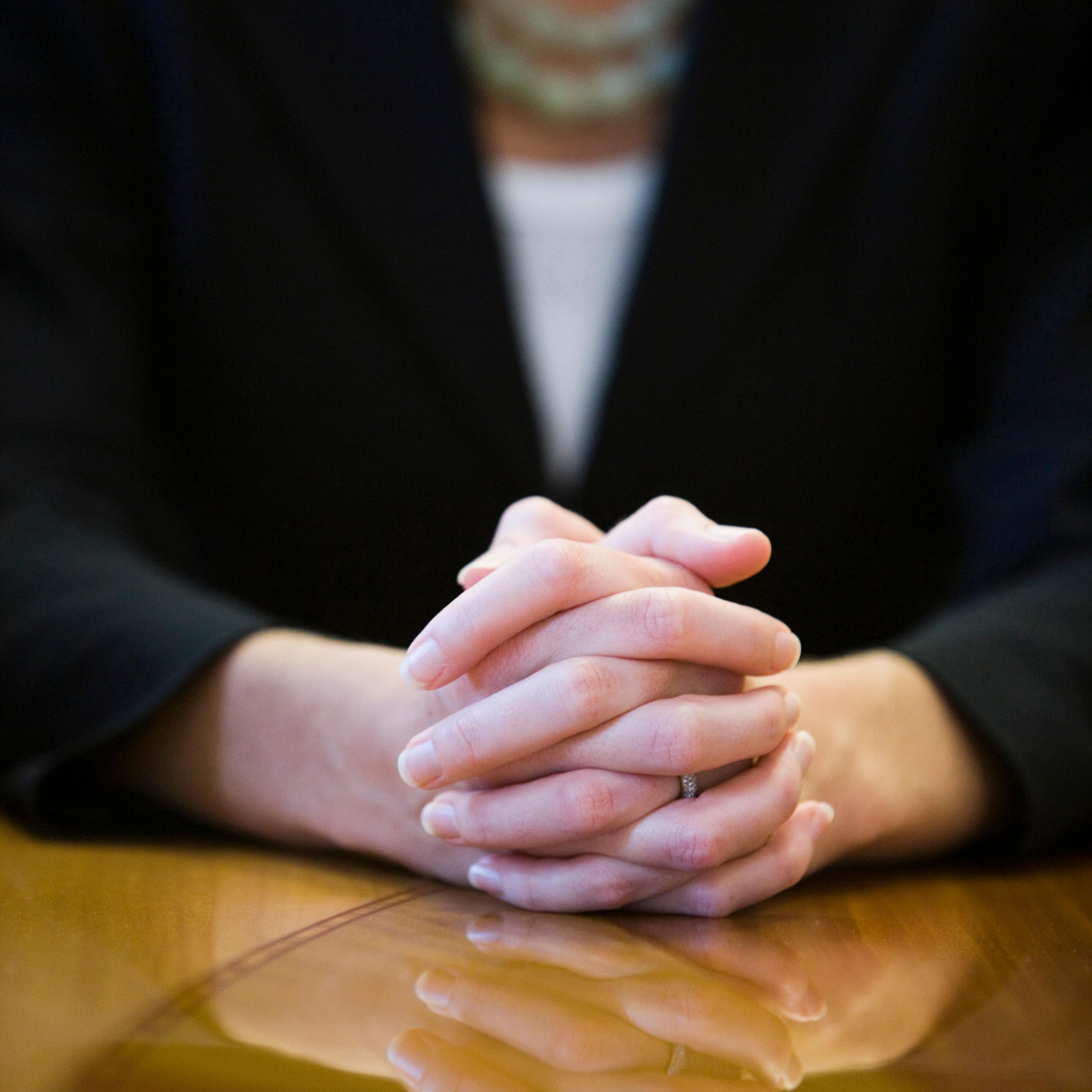 businesswoman-hands-clasped