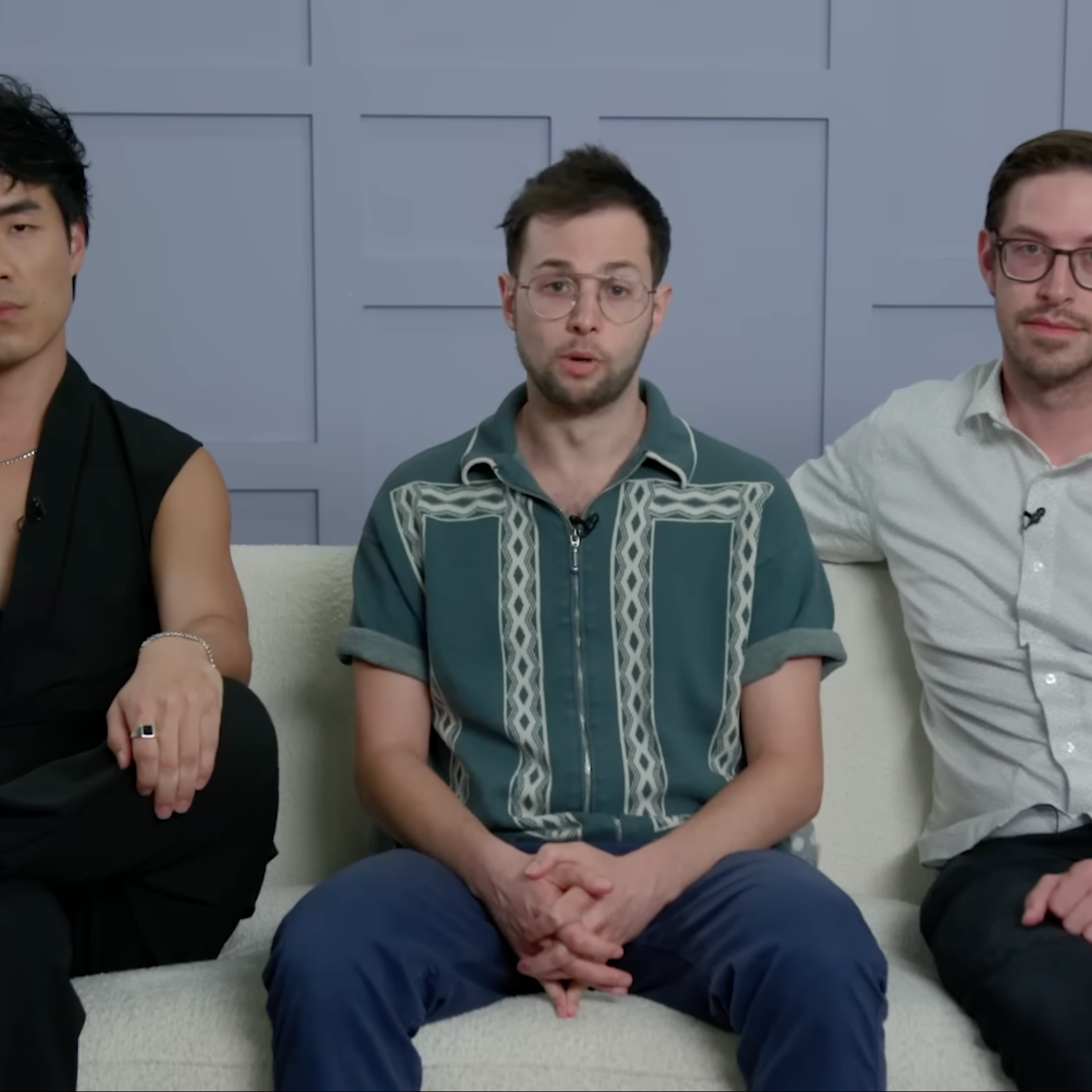 The Try Guys sitting on a couch looking at the camera