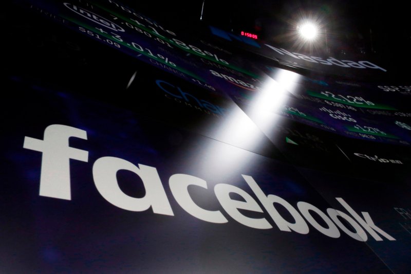 In this March 29, 2018, file photo the logo for Facebook appears on screens at the Nasdaq MarketSite in New York’s Times Square. 
