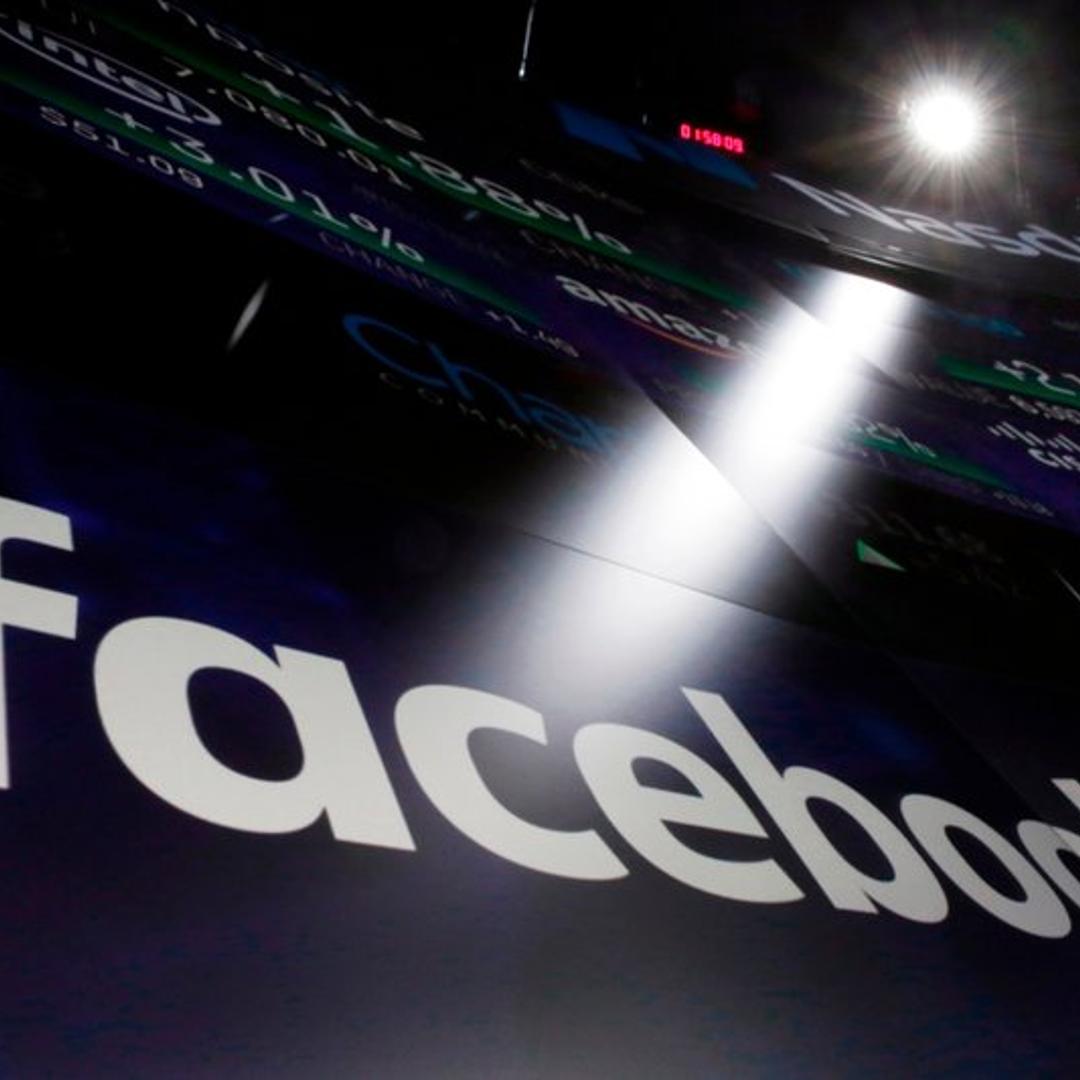 In this March 29, 2018, file photo the logo for Facebook appears on screens at the Nasdaq MarketSite in New York’s Times Square.