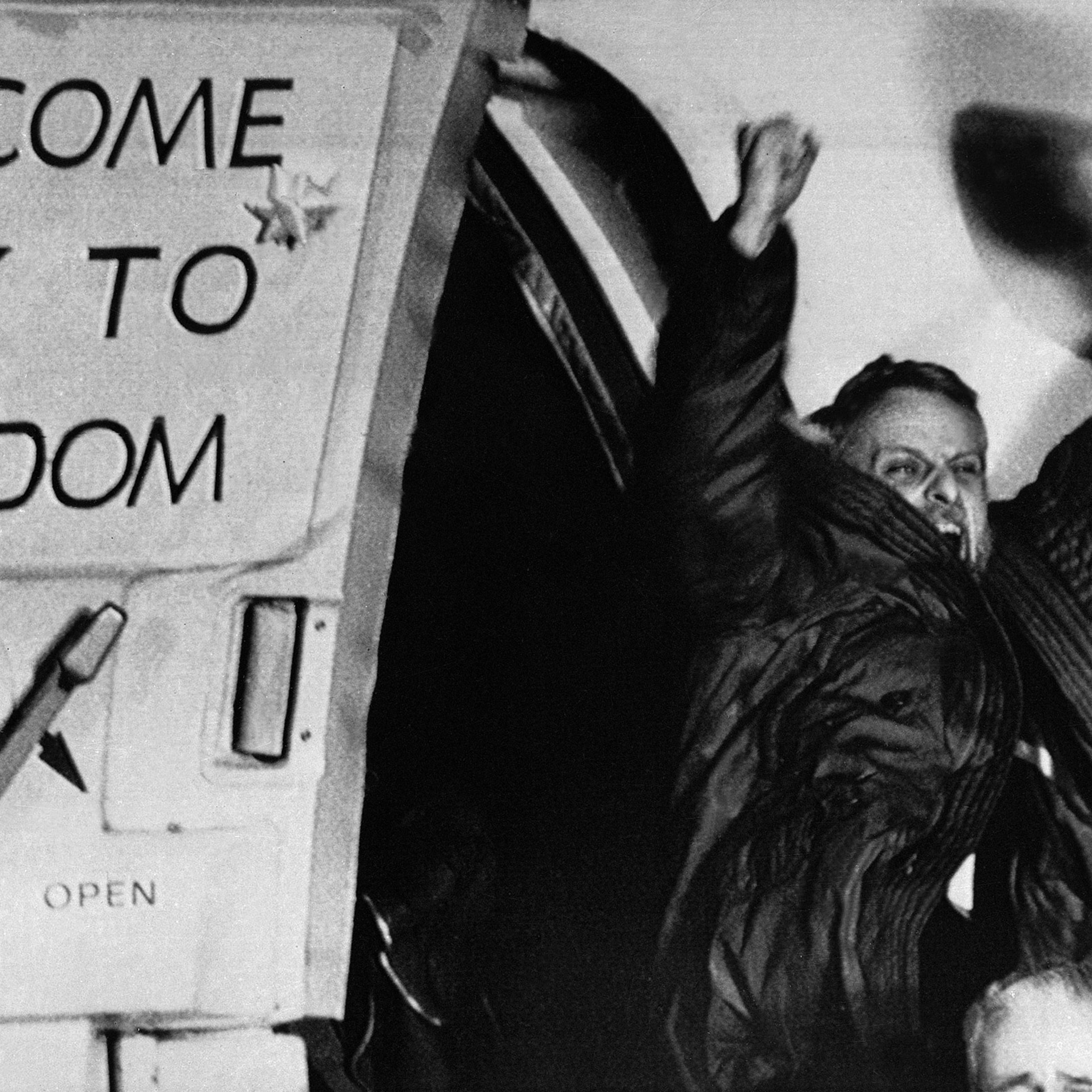 Freed U.S. hostage David Roeder shouts and waves as he arrives at Rhein-Main U.S. Air Force base in Frankfurt, Germany. Roeder was among 52 Americans held hostage in Iran for 444 days after their capture at the U.S. Embassy in Tehran. January 21, 1981.