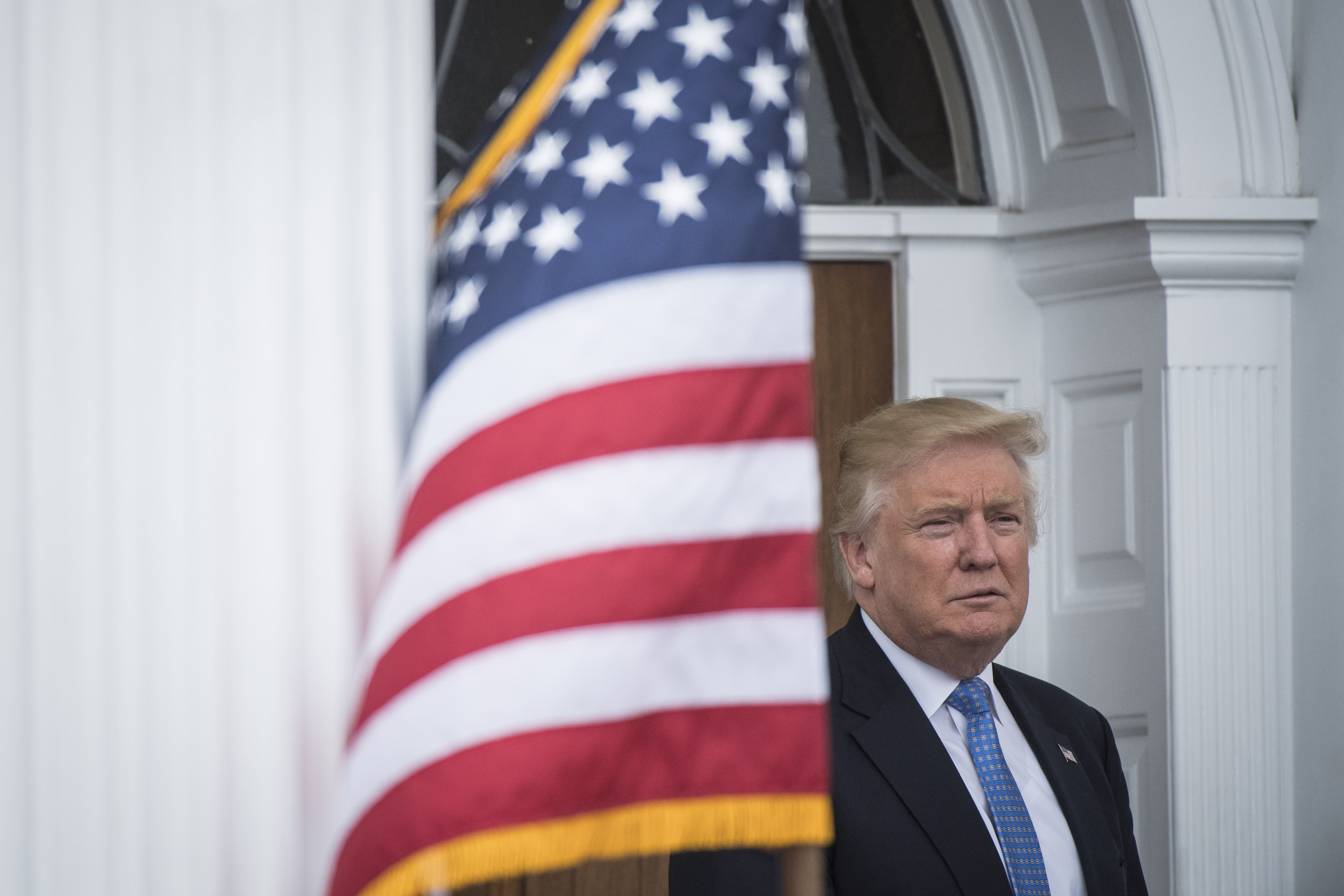 President-elect Donald Trump walks out at the clubhouse at Trump National Golf Club Bedminster in Bedminster Township, N.J. on Nov. 20, 2016.