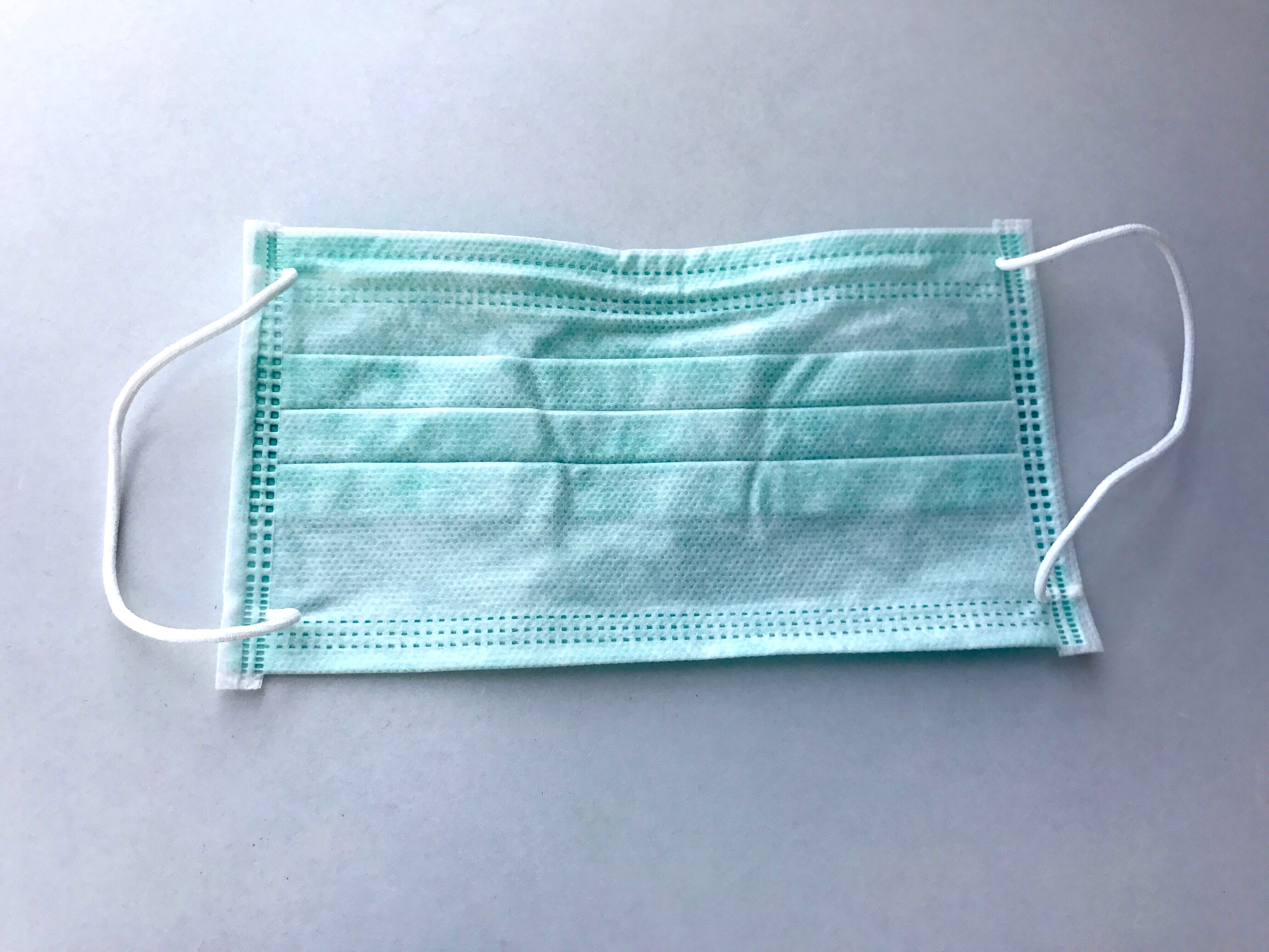 High Angle View Of Surgical Mask On Table
