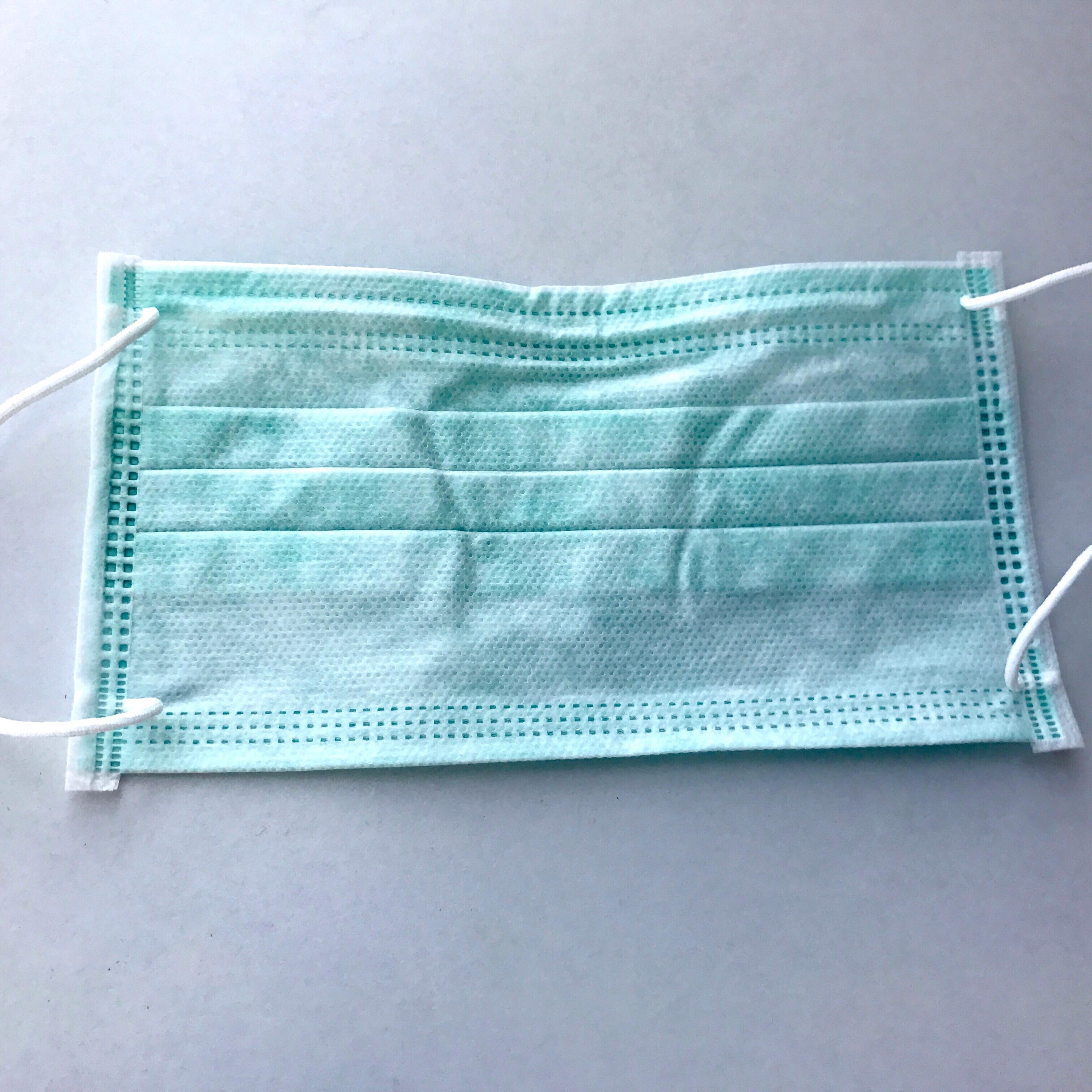 High Angle View Of Surgical Mask On Table