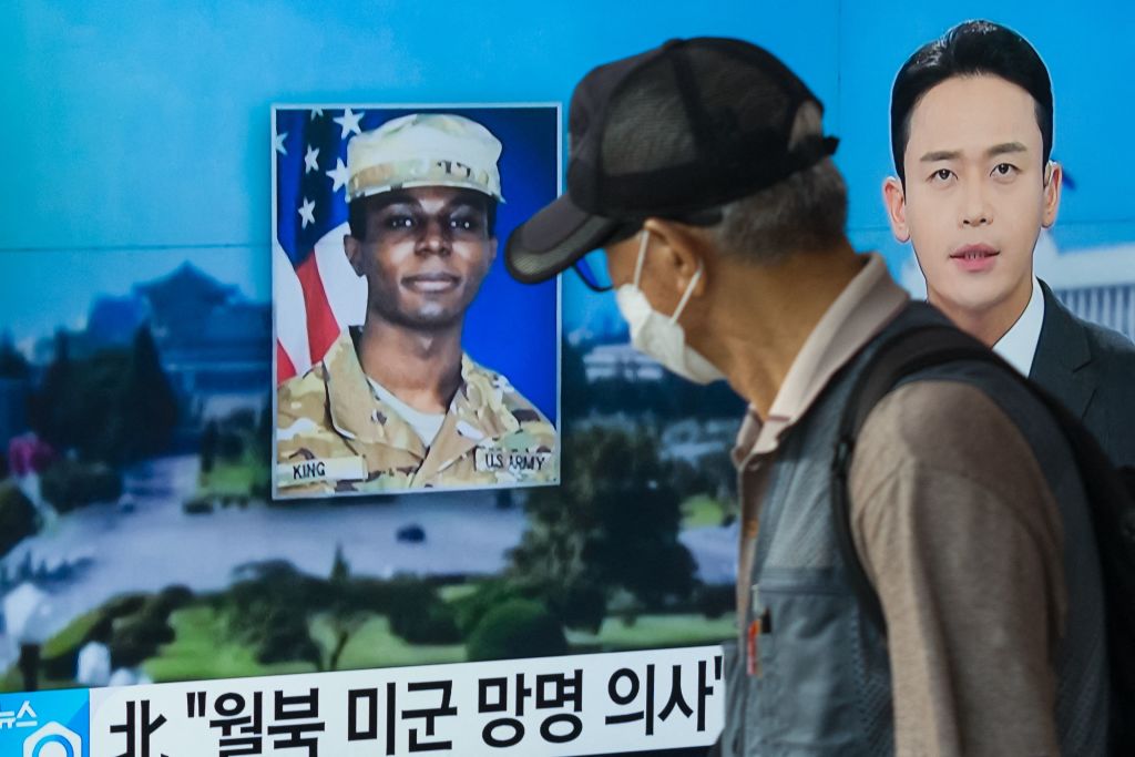 a television showing a news broadcast featuring a photo of U.S. soldier Travis King