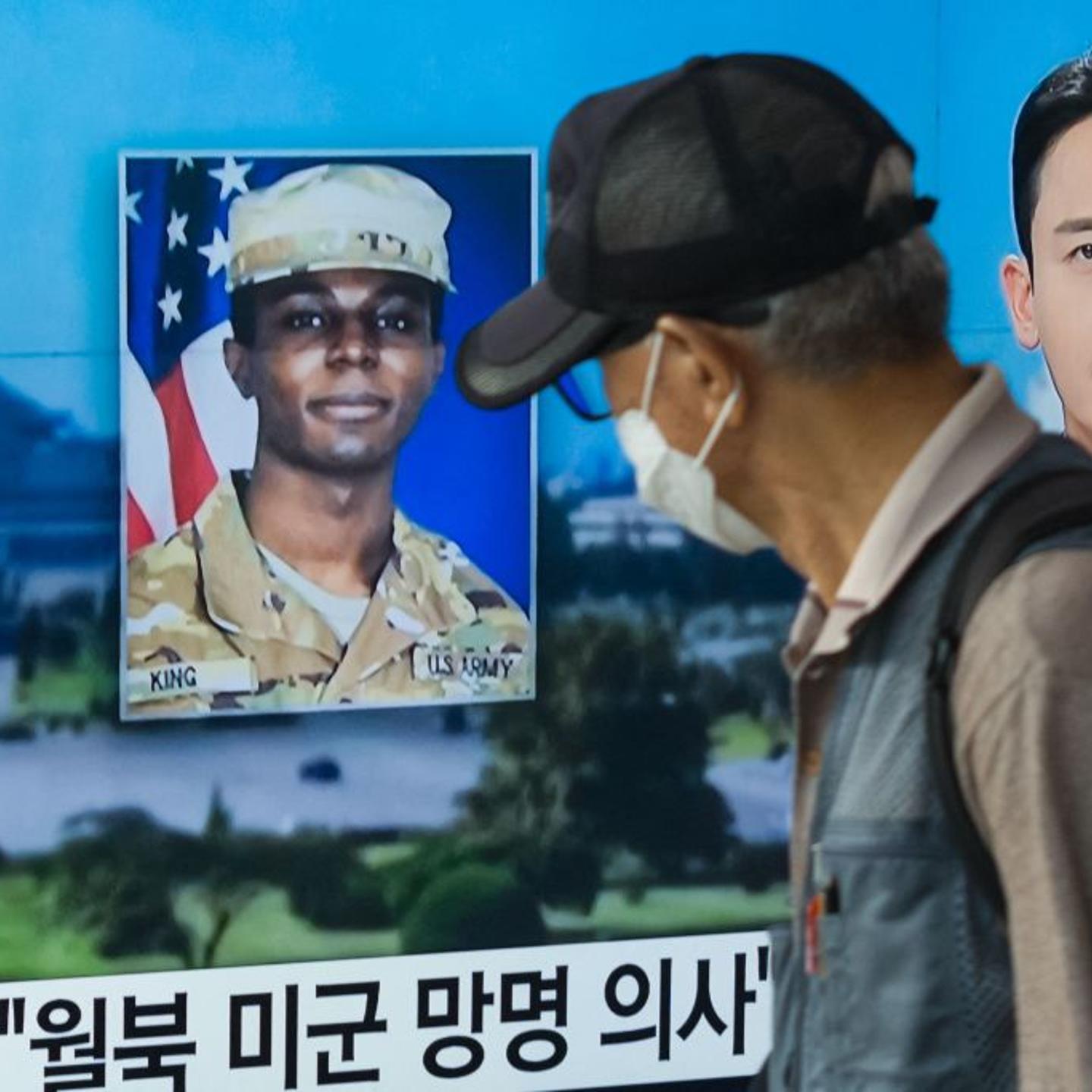 a television showing a news broadcast featuring a photo of U.S. soldier Travis King