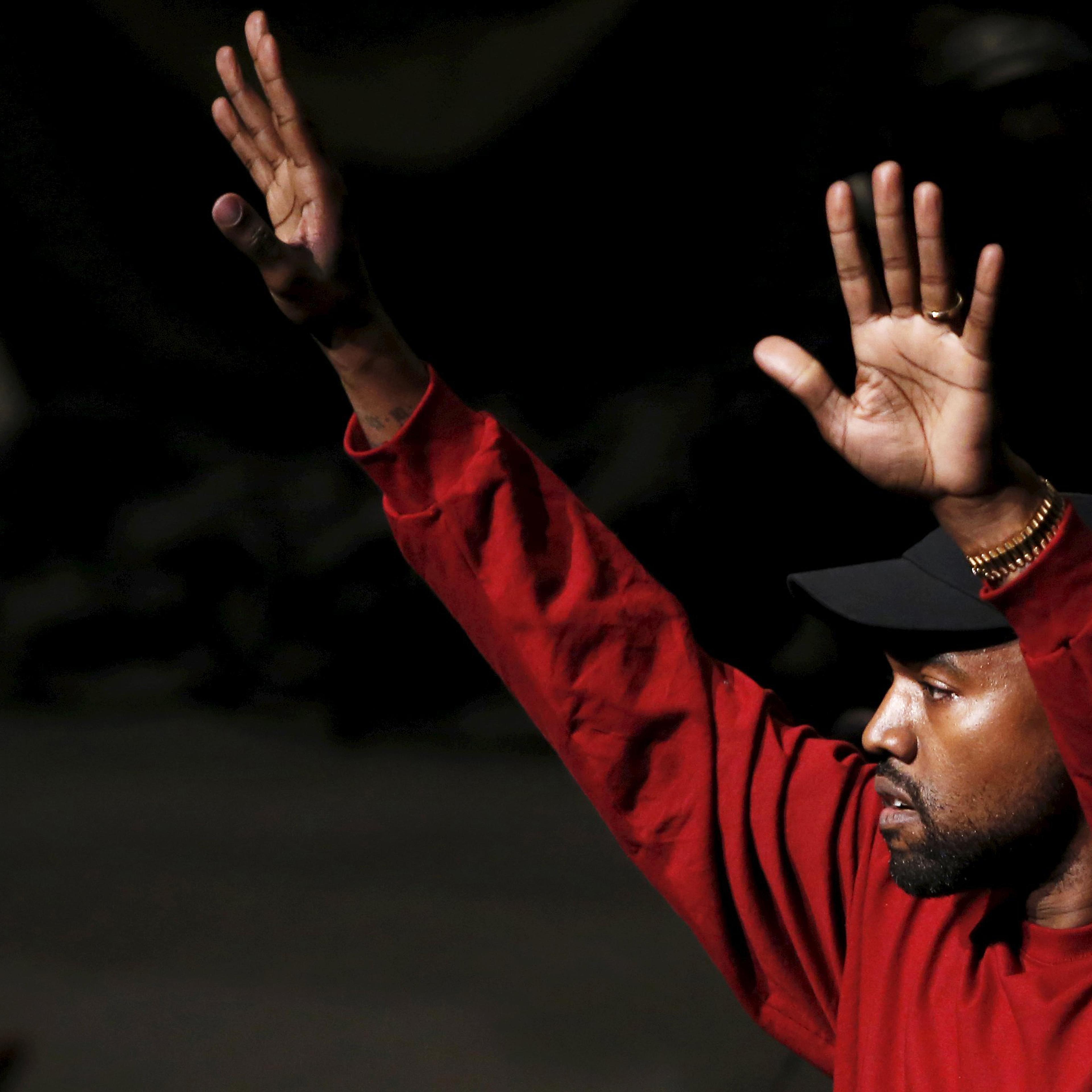 Kanye West acknowledges attendees during his Yeezy Season 3 Collection presentation and listening party at New York Fashion Week on Feb. 11, 2016. Hillary Clinton Democratic Debate