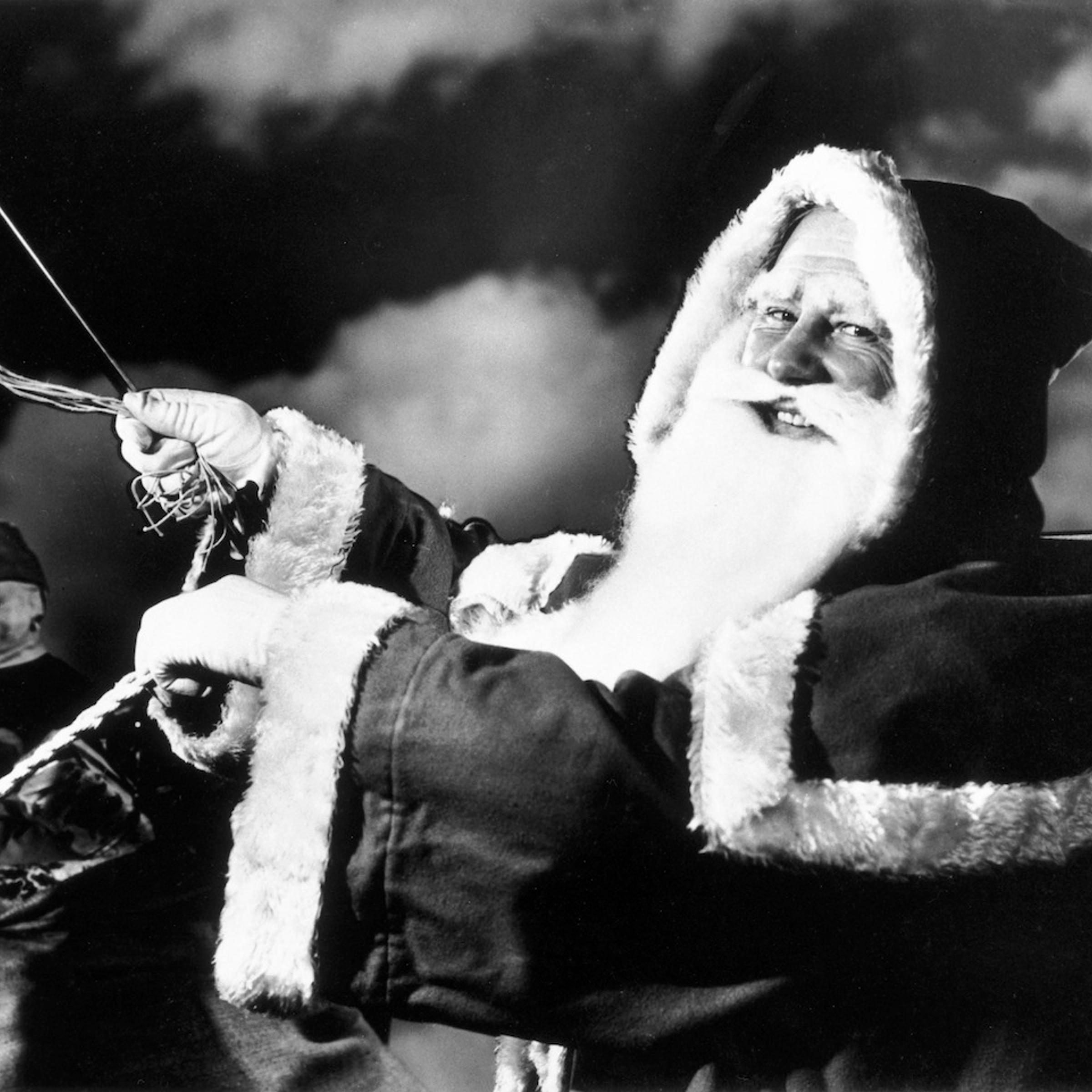 Father Christmas riding in his sleigh, c 1940s.