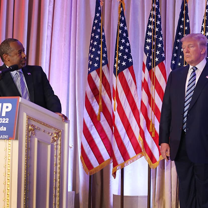 Former Republican presidential candidate Ben Carson looks back at Republican presidential candidate Donald Trump as he give him his endorsement at the Mar-A-Lago Club on March 11, 2016 in Palm Beach, Florida.