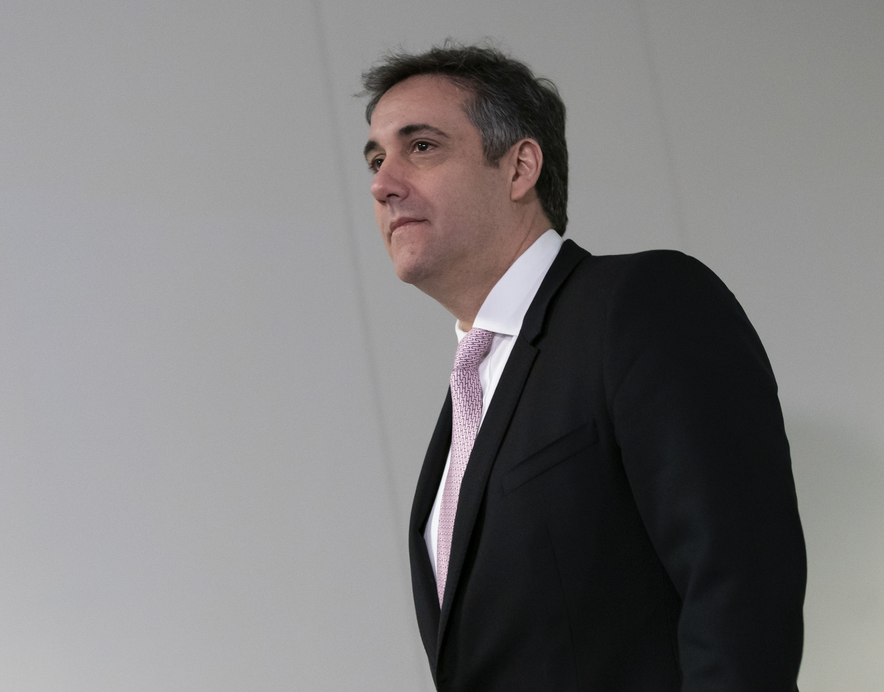 Former Trump attorney Michael Cohen arrives for his appearance before the Senate Intelligence Committee