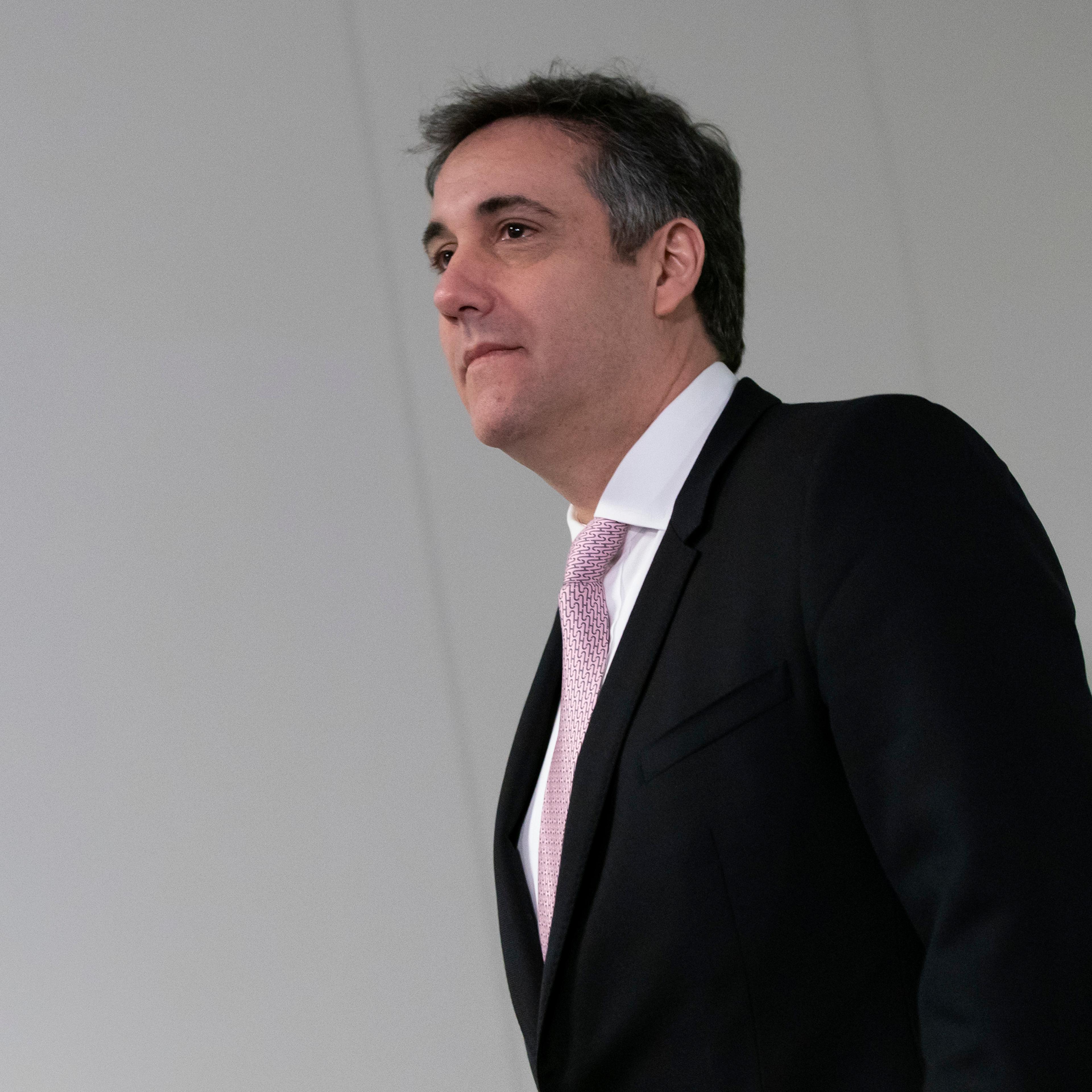 Former Trump attorney Michael Cohen arrives for his appearance before the Senate Intelligence Committee