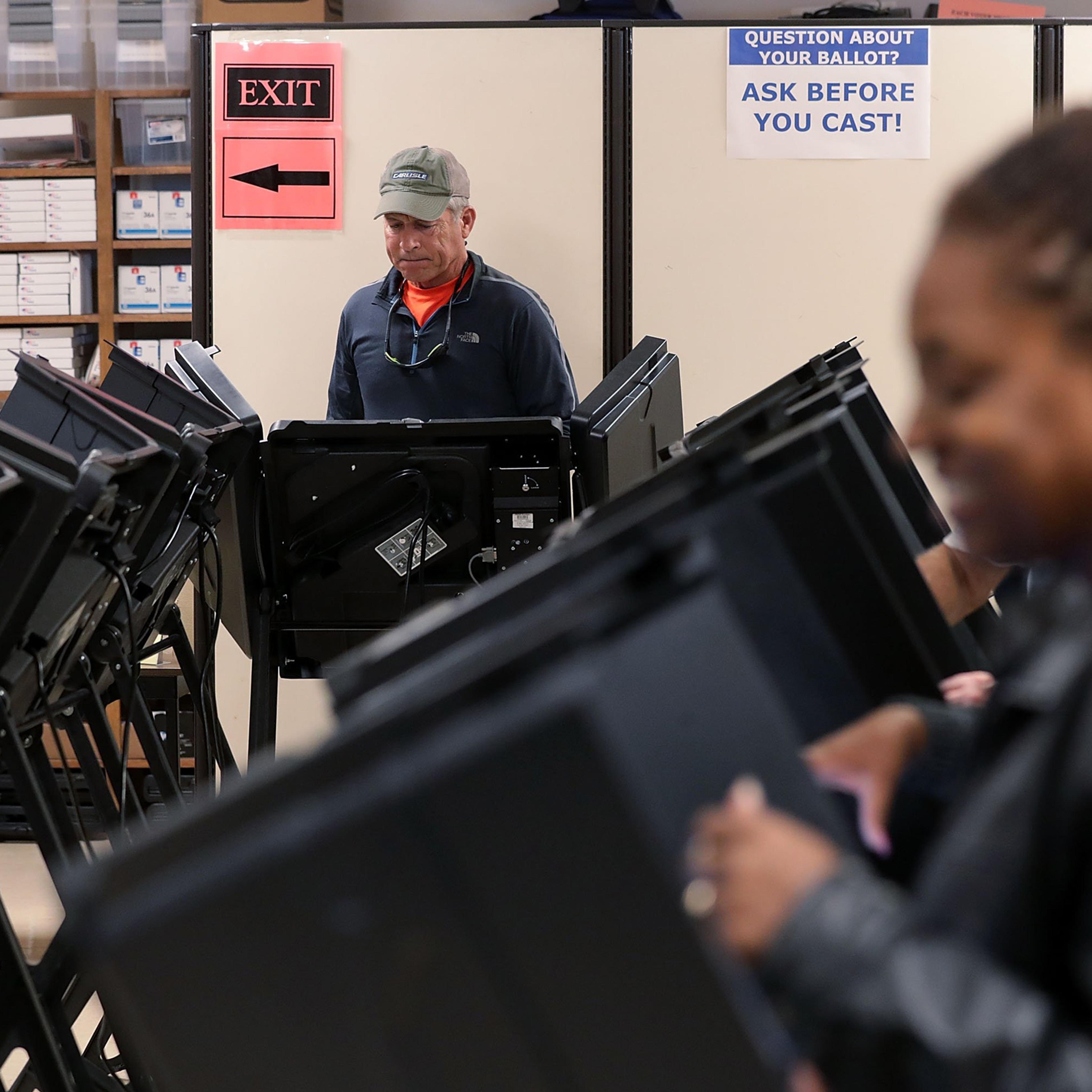 WINSTON-SALEM, NC - OCTOBER 28: Voters cast their ballots during early voting for the 2016 general election at Forsyth County Government Center October 28, 2016 in Winston-Salem, North Carolina. Early voting has begun in North Carolina through November 5