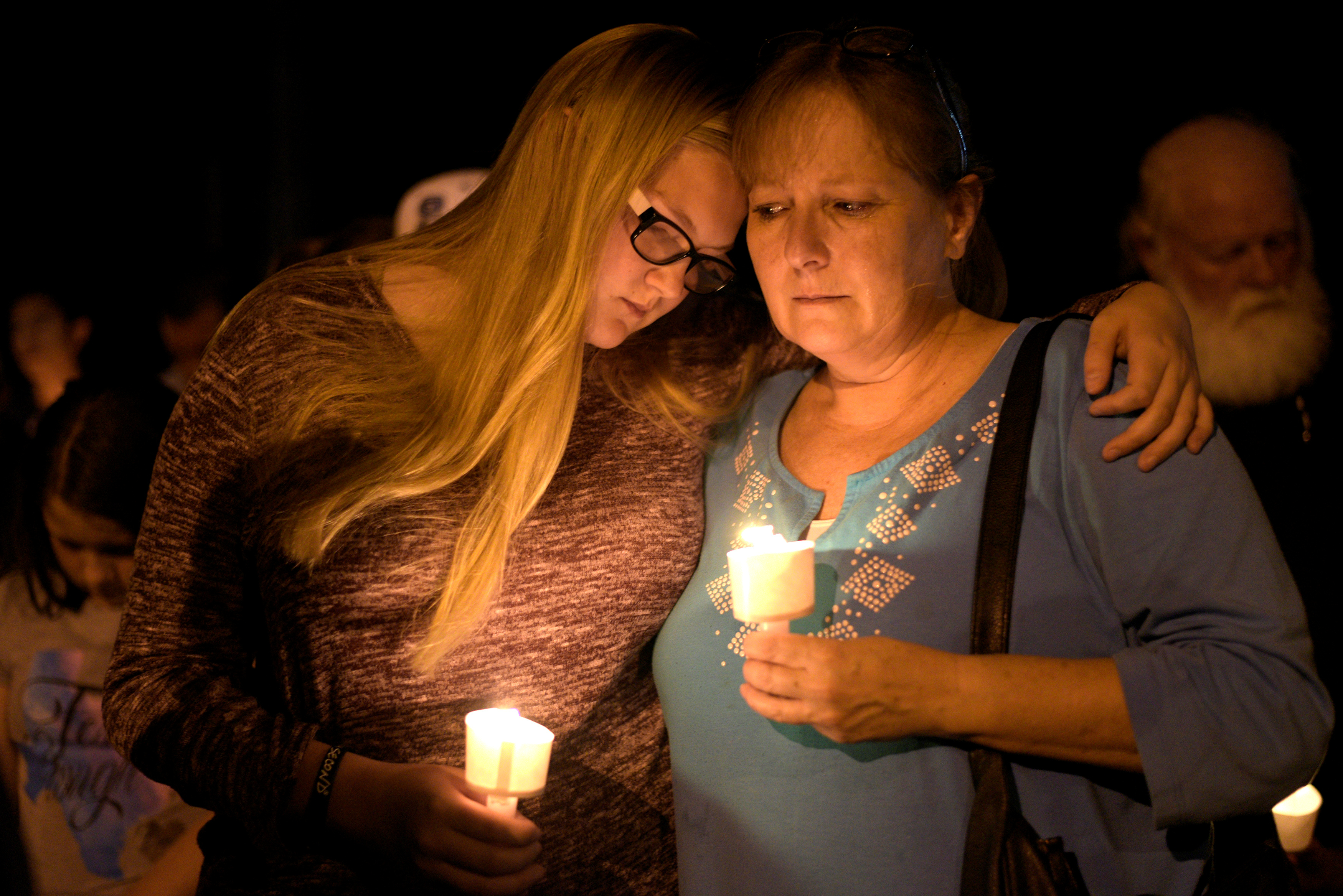 Mourners attend a candle light vigil after a mass shooting at the First Baptist Church in Sutherland Springs