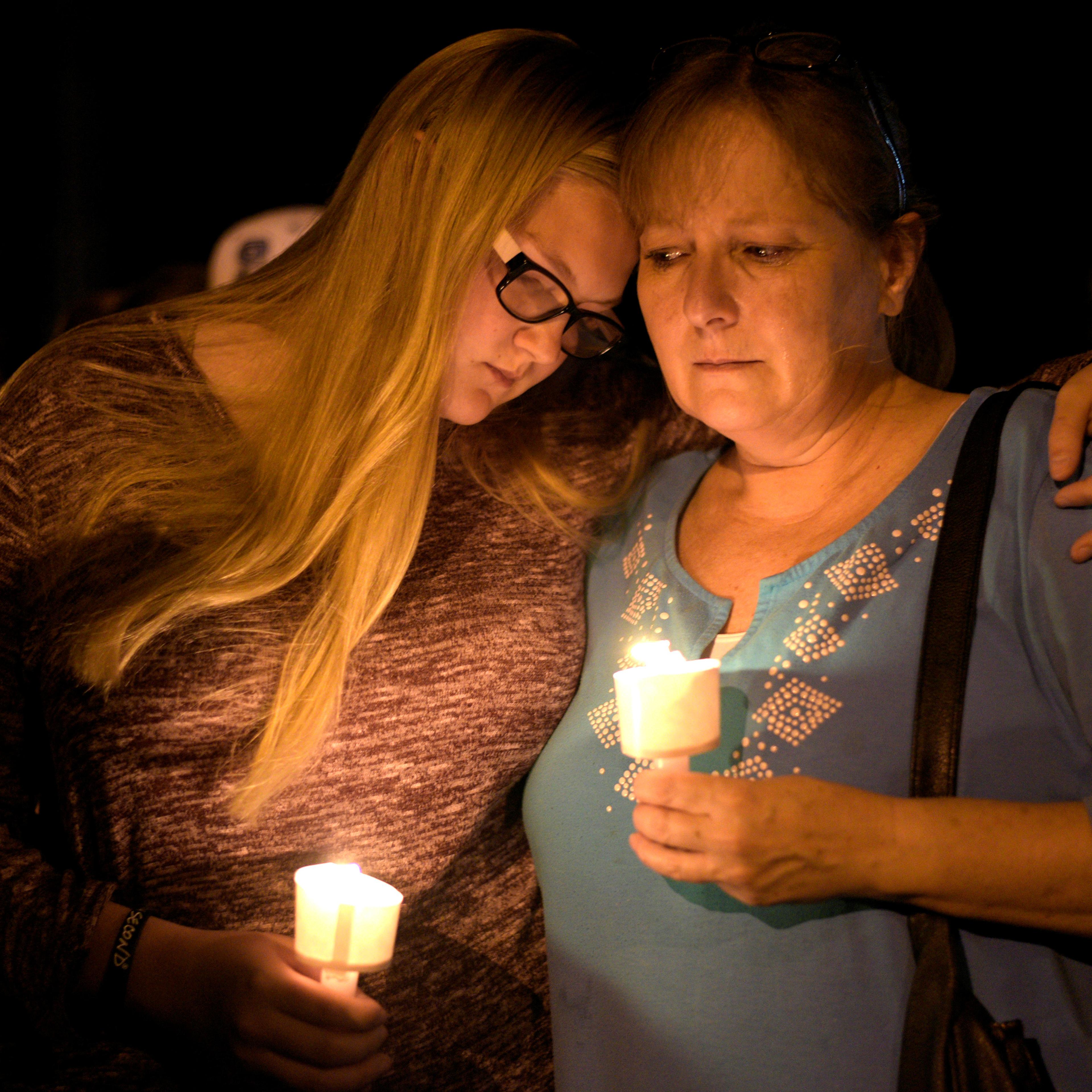 Mourners attend a candle light vigil after a mass shooting at the First Baptist Church in Sutherland Springs