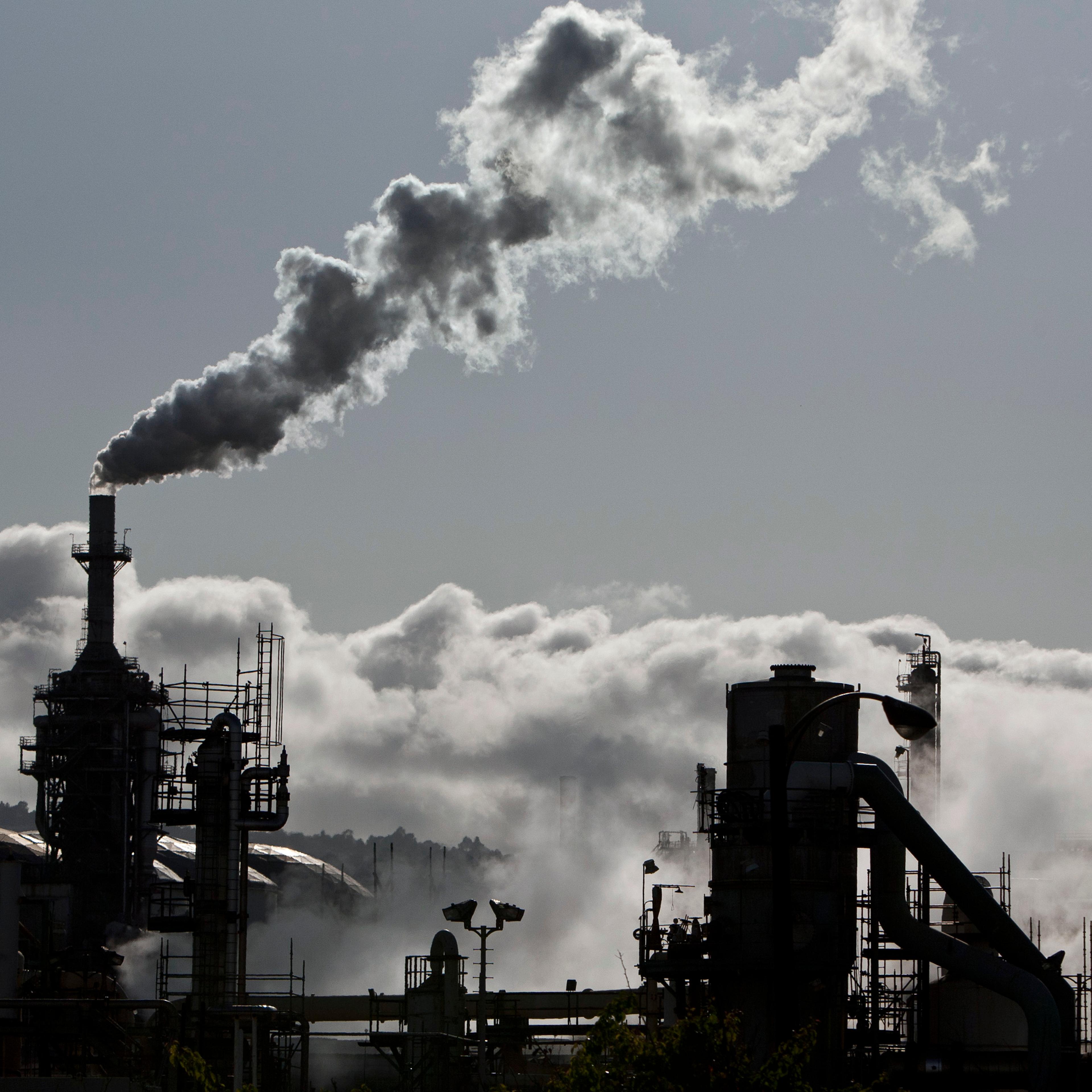 Smoke is released into the sky at an oil refinery in Wilmington