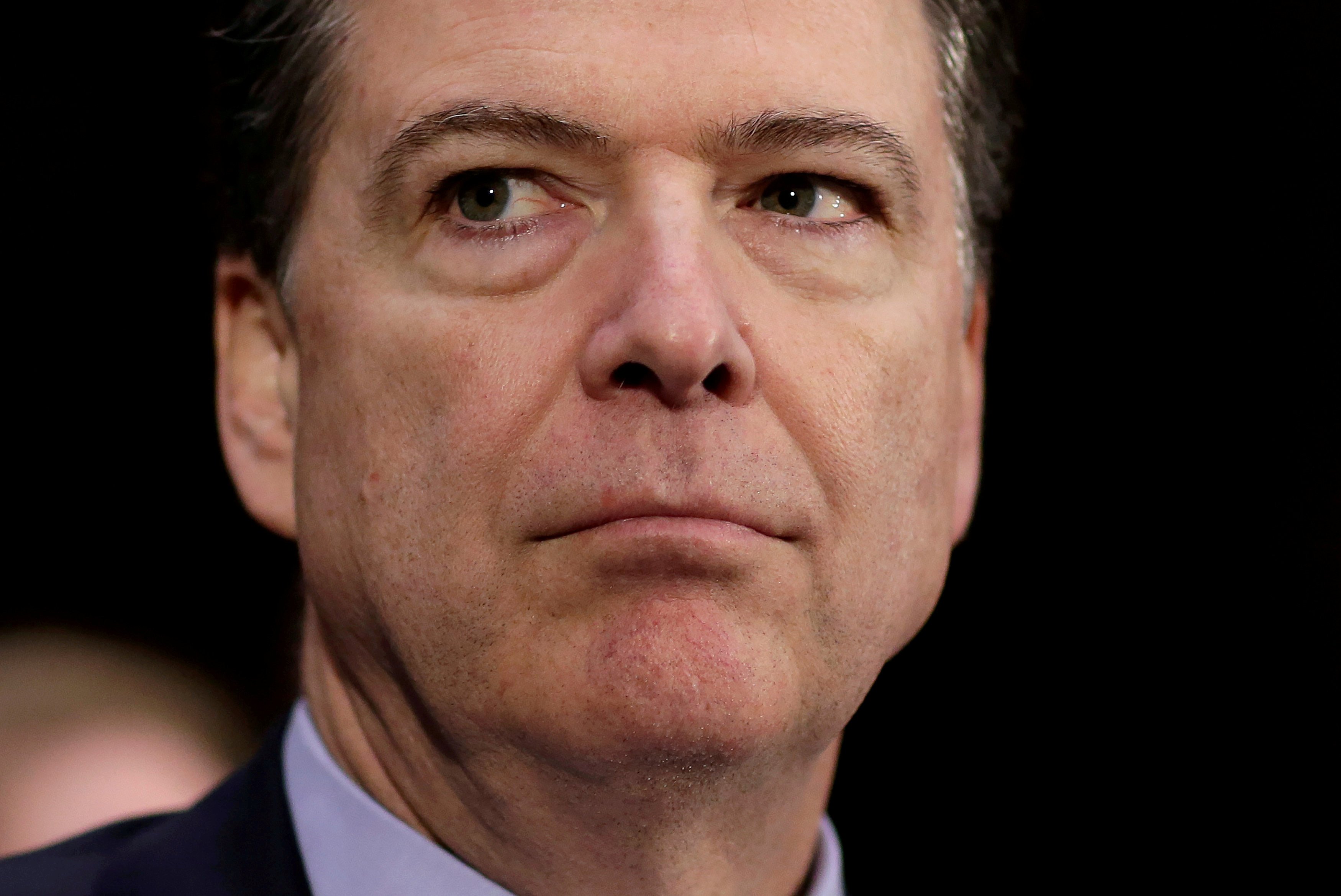 FILE PHOTO  - FBI Director James Comey waits to testify to the Senate Select Committee on Intelligence hearing on "Russia's intelligence activities" on Capitol Hill in Washington
