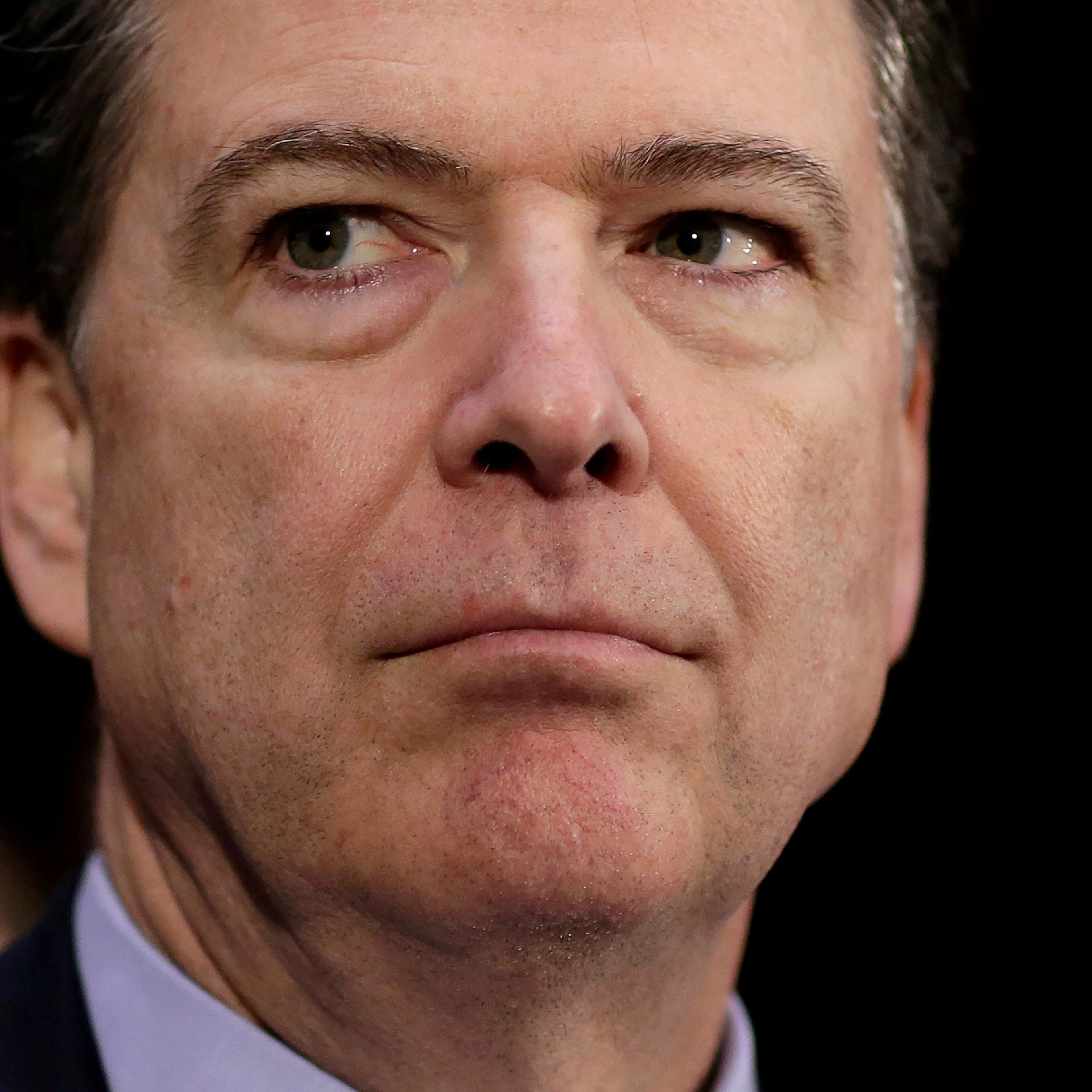 FILE PHOTO - FBI Director James Comey waits to testify to the Senate Select Committee on Intelligence hearing on "Russia's intelligence activities" on Capitol Hill in Washington
