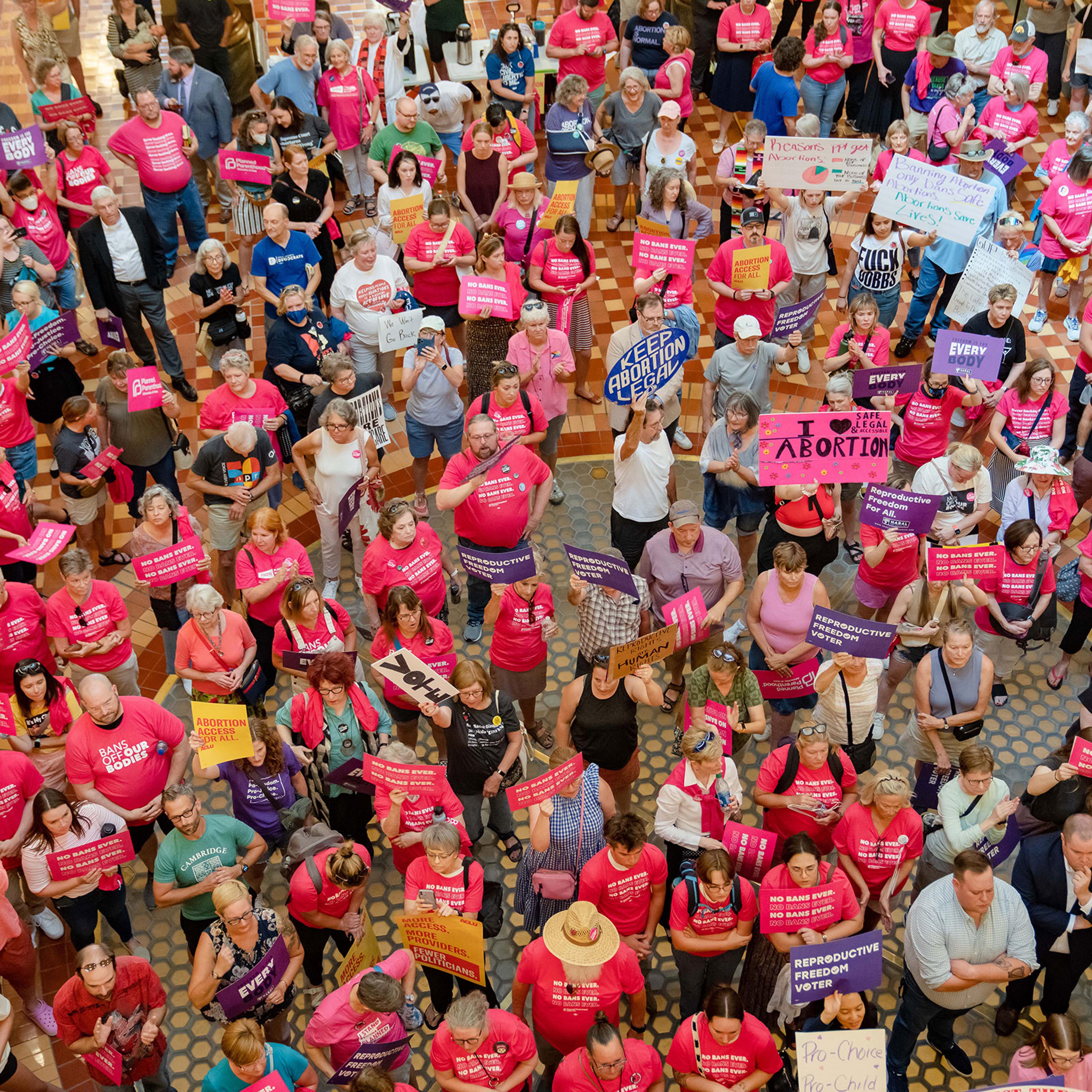 Protestors hold a rally for reproductive rights in the Iowa State Capitol rotunda as the Iowa Legislature convenes for special