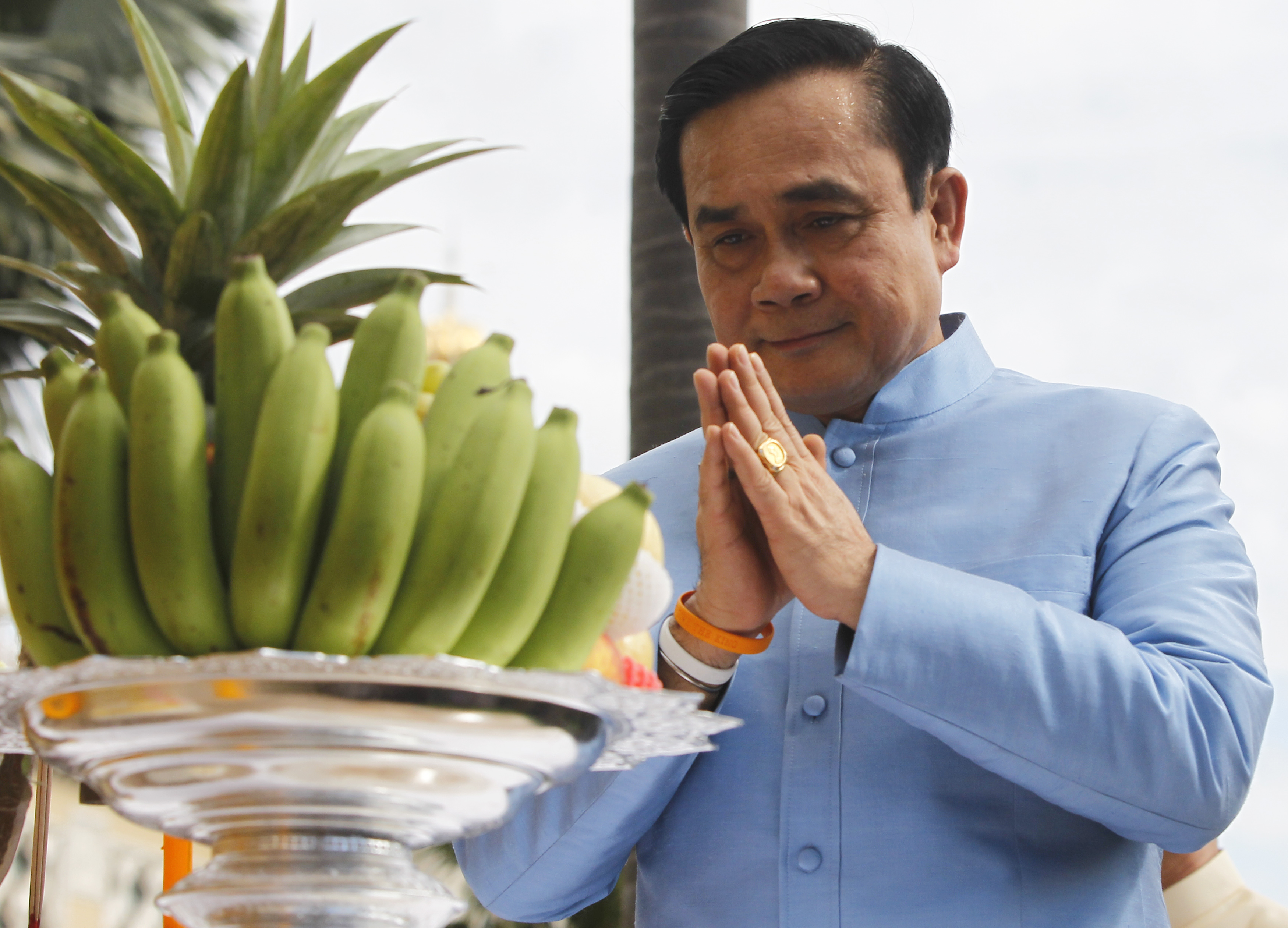 Thailand's Prime Minister Chan-ocha prays before the first cabinet meeting at the Government House in Bangkok