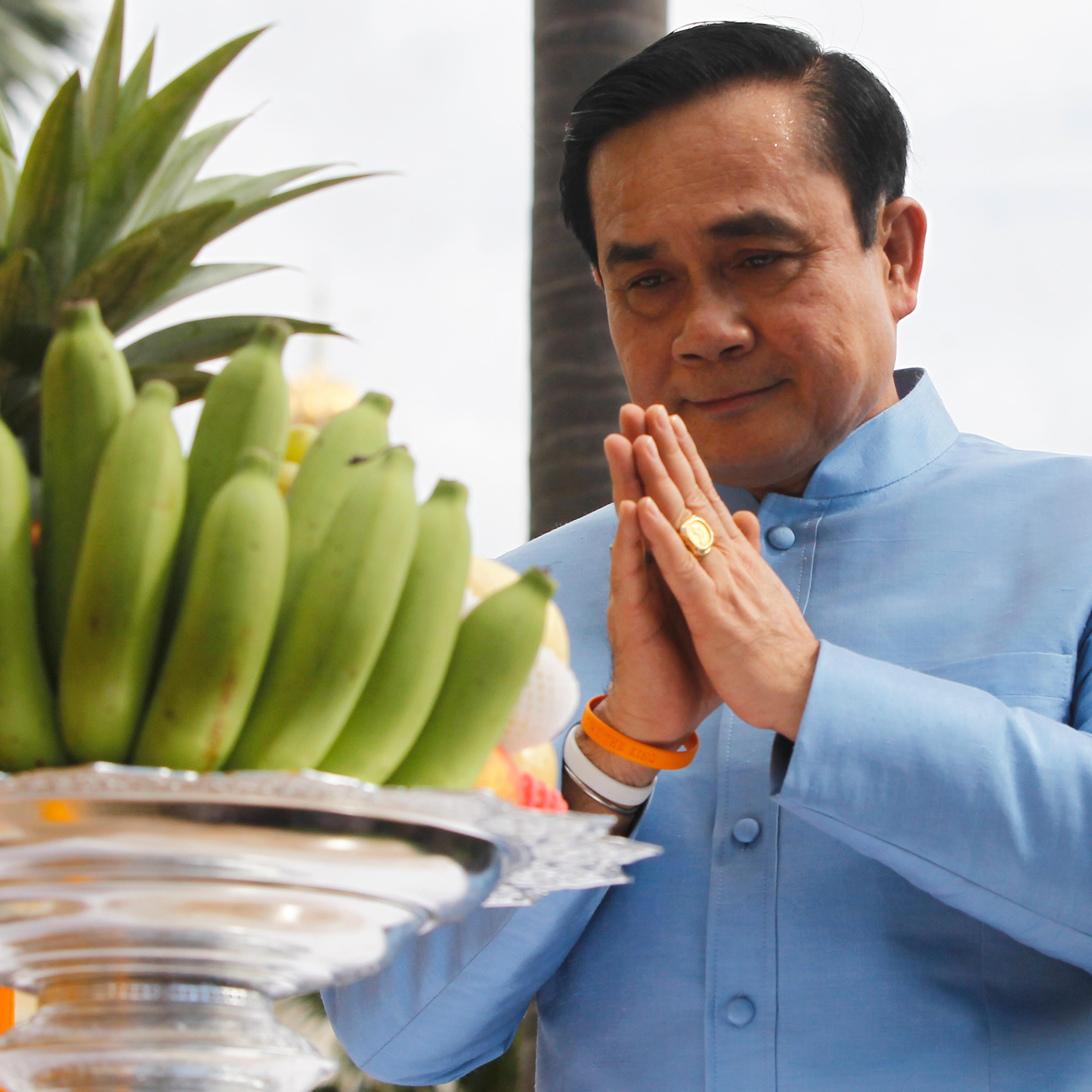 Thailand's Prime Minister Chan-ocha prays before the first cabinet meeting at the Government House in Bangkok