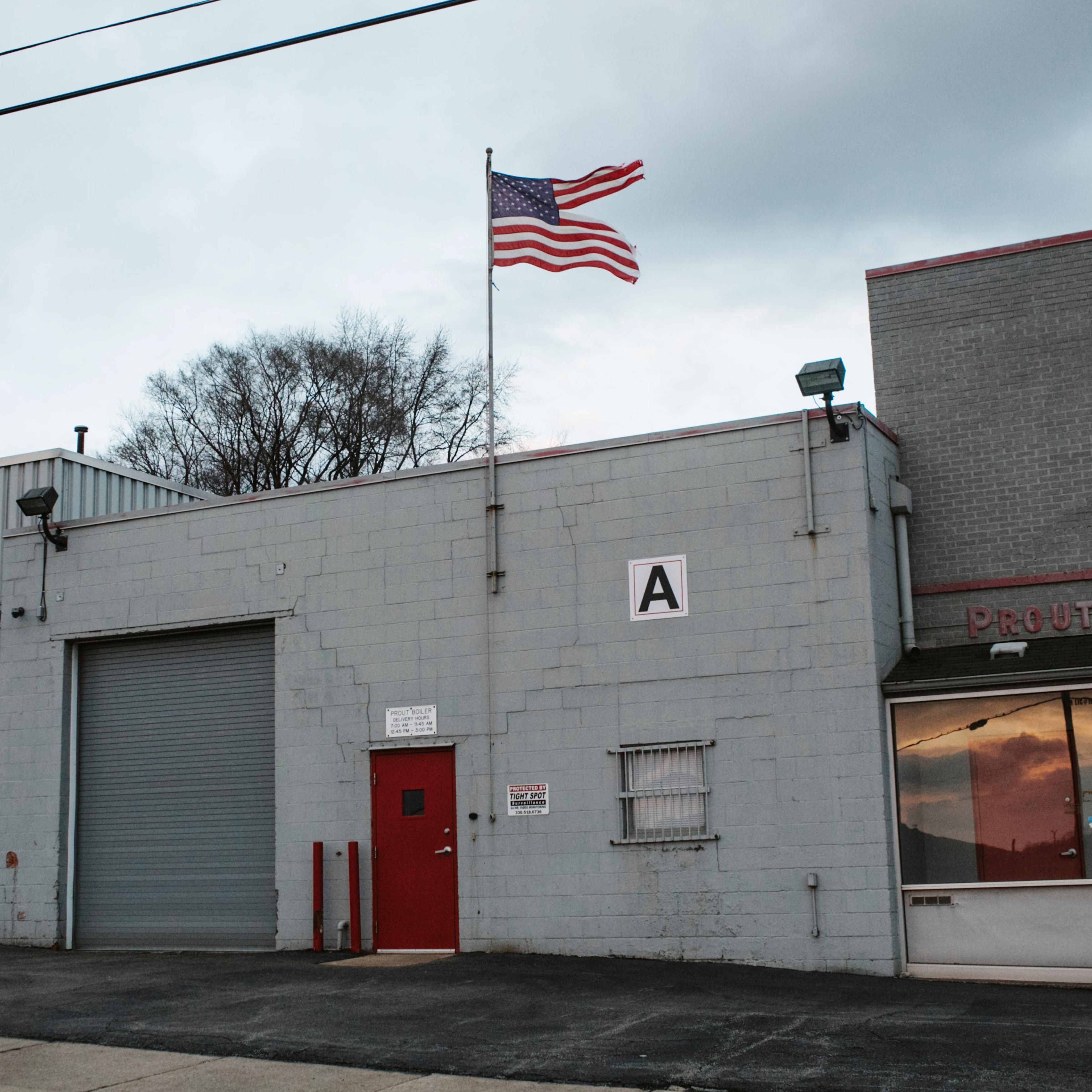 A tattered American flag flies over a heating business in Youngstown, Ohio on March 2, 2017.
