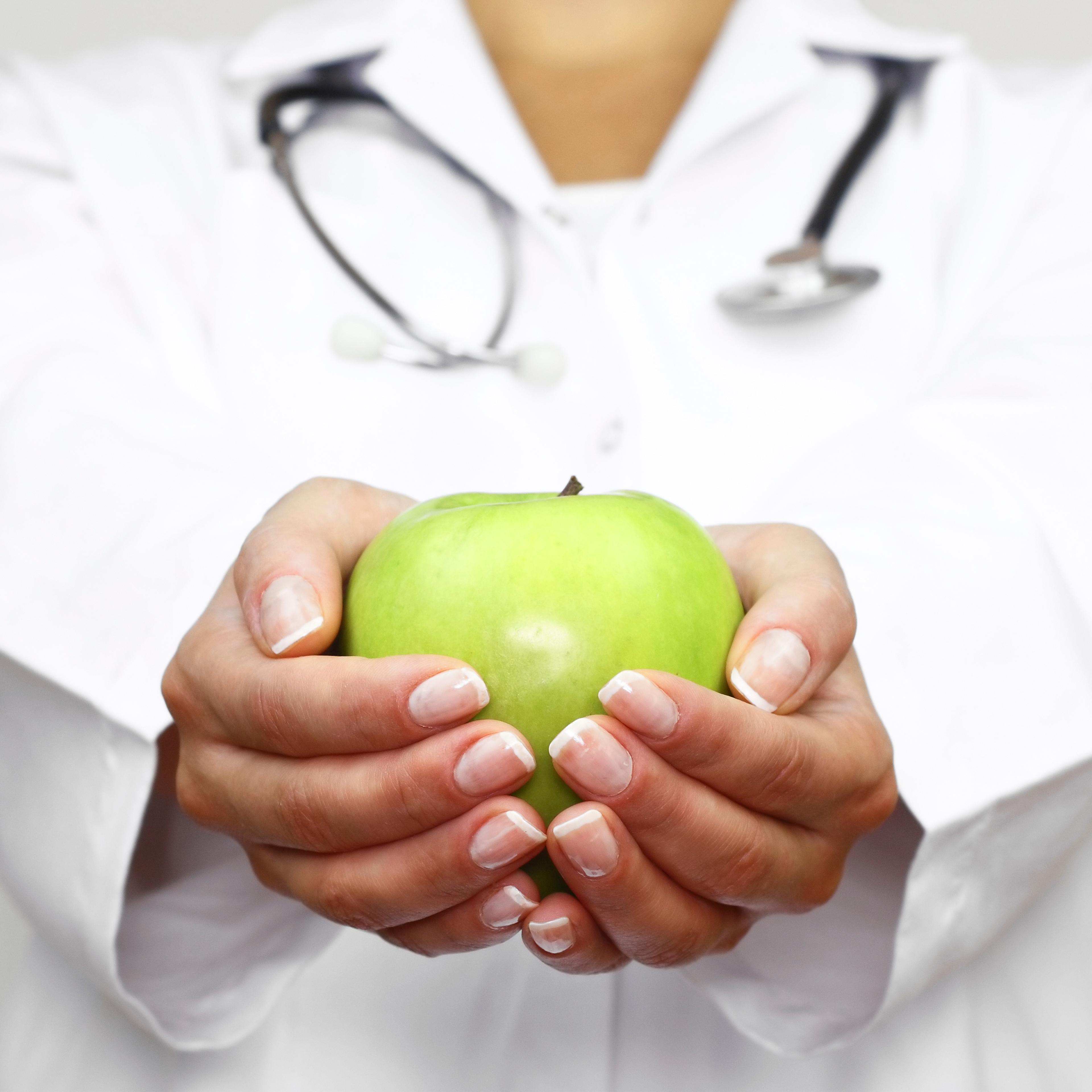doctor-holding-green-apple