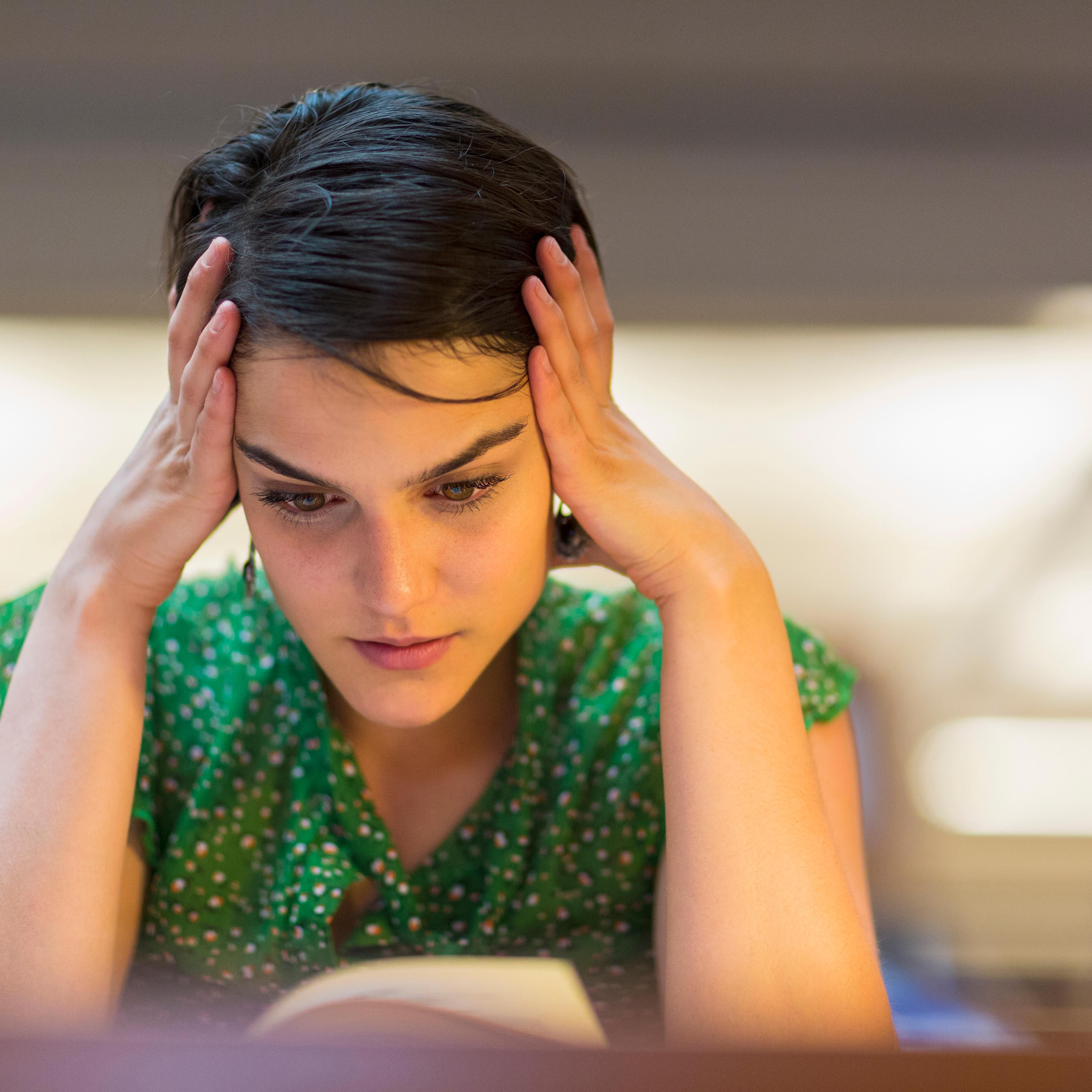Mixed race student studying in library