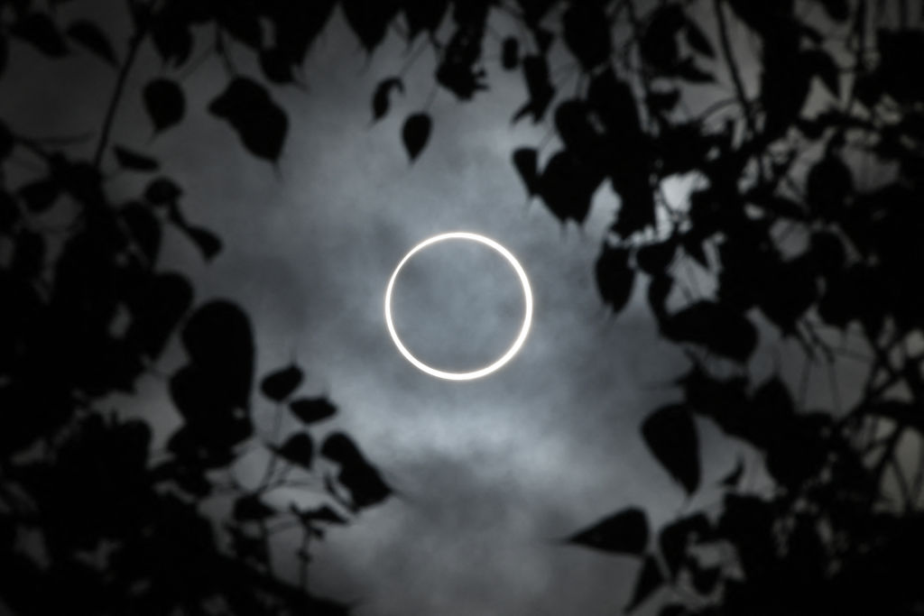 The moon totally covers the sun in a rare "ring of fire" solar eclipse as seen from the south Indian city of Dindigul in Tamil Nadu state on Dec. 26, 2019.