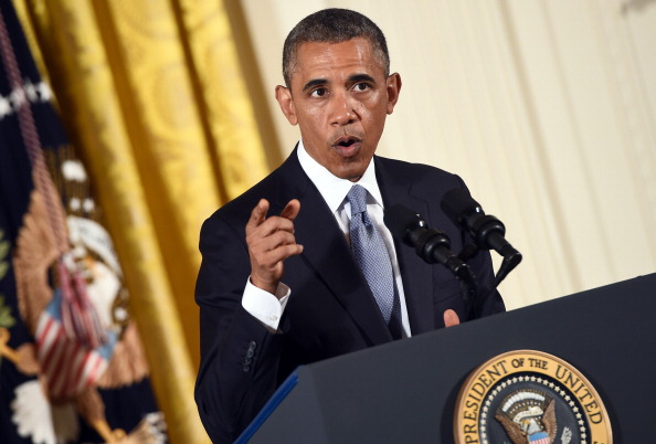 US President Barack Obama speaks before signing an Executive Order to protect LGBT (lesbian, gay, bisexual, and transgender) employees from workplace discrimination in the East Room at the White House in Washington, DC, on July 21, 2014.