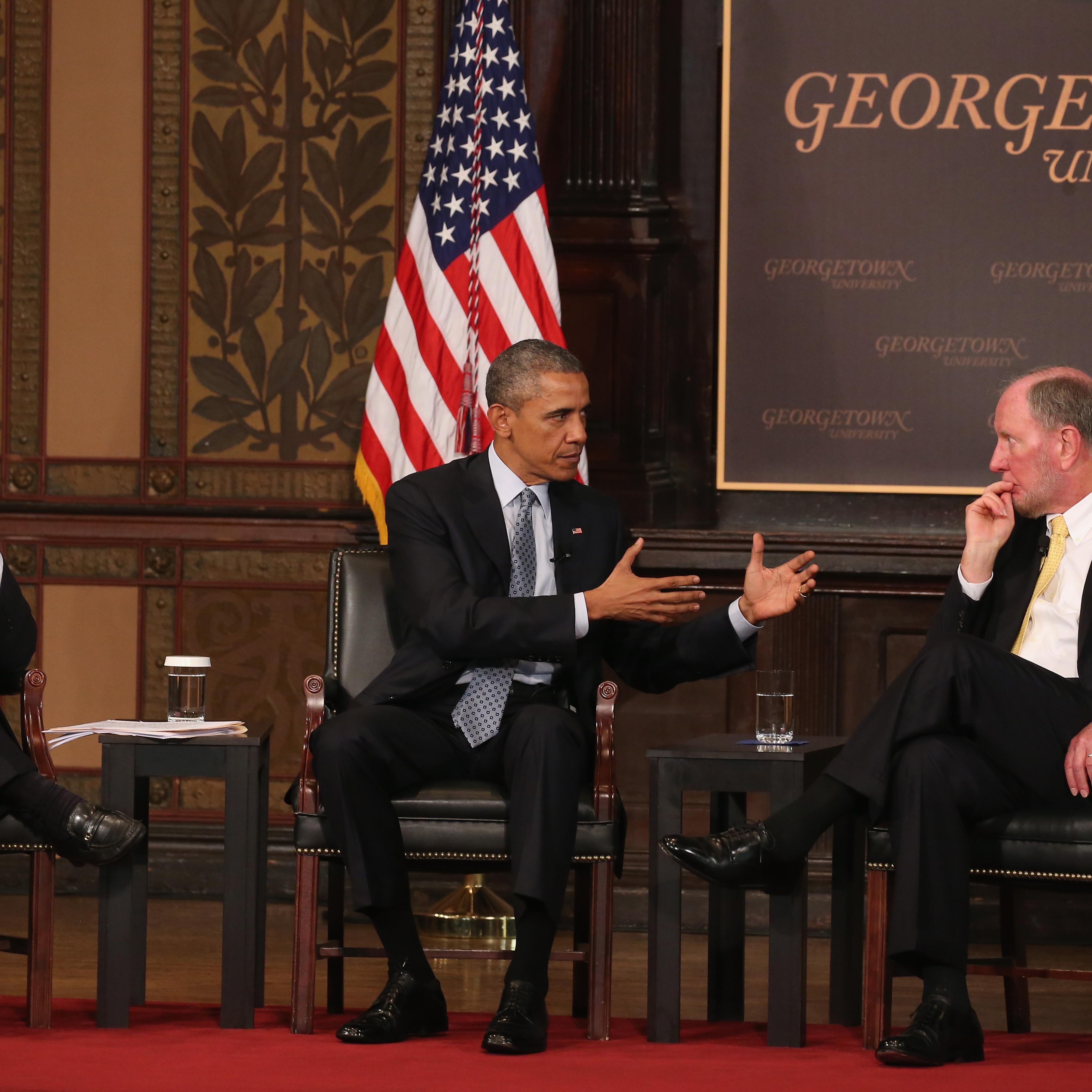 President Barack Obama participates in a discussion on poverty with moderator E.J. Dionne, Jr. and Robert Putman Professor at Harvard University, at Georgetown University May 12, 2015 in Washington, DC.