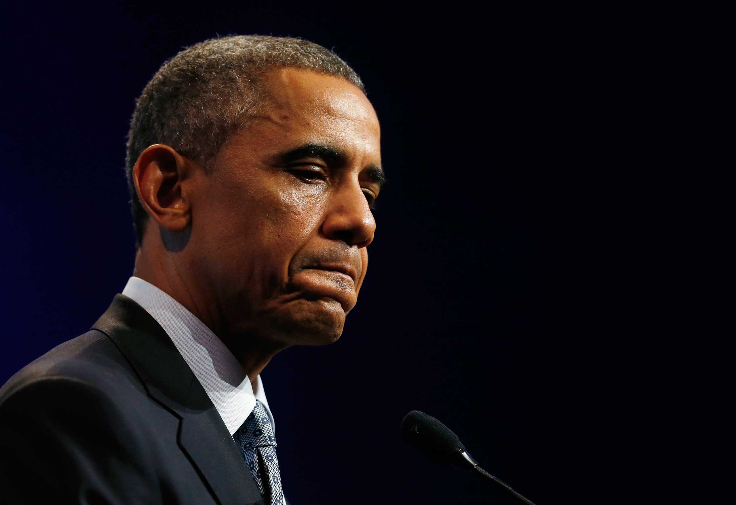 U.S. President Barack Obama listens to a question at a news conference at the end of the G20 summit in Brisbane