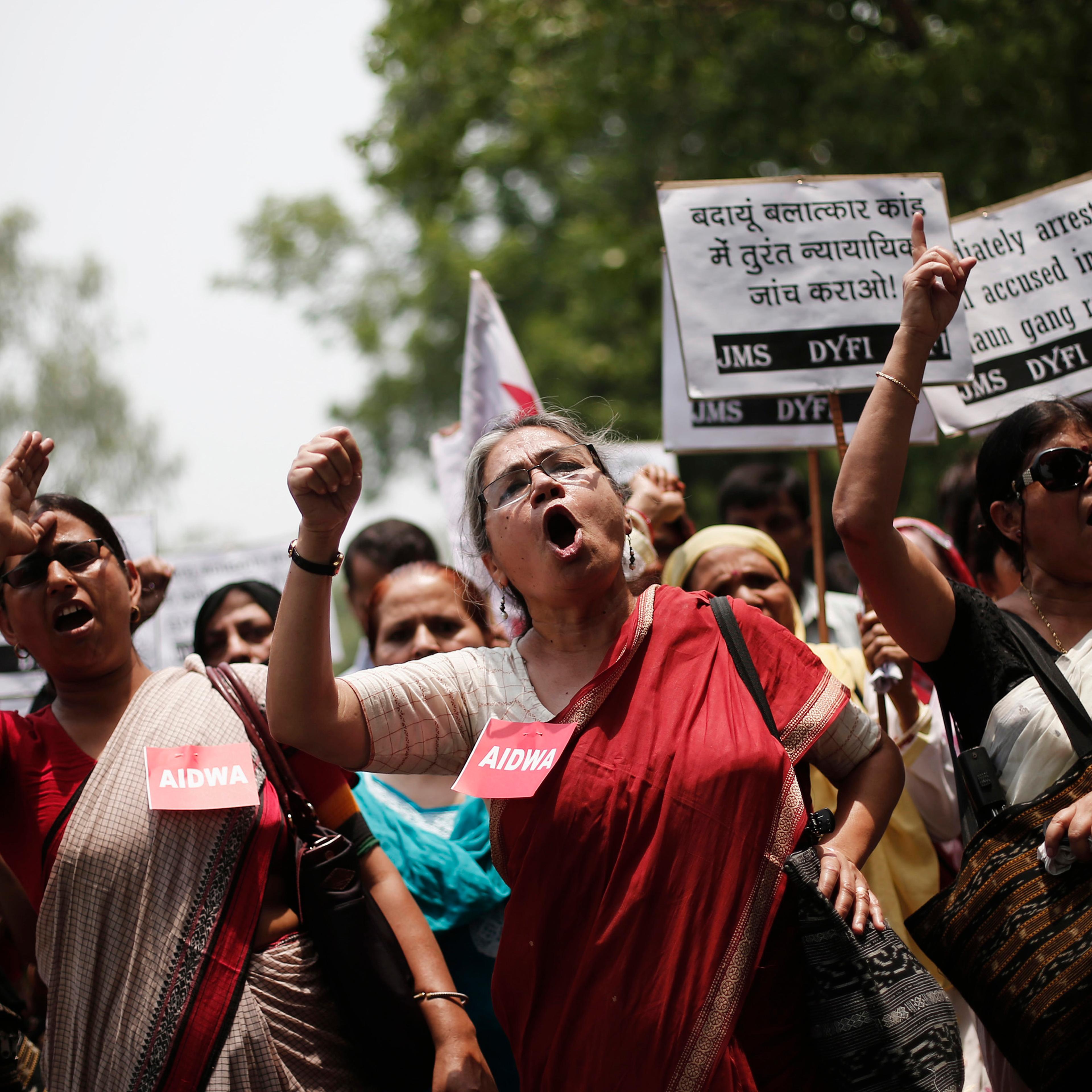 Demonstrators from All India Democratic Women's Association hold placards and shout slogans during protest against recent killings of two teenage girls, in New Delhi