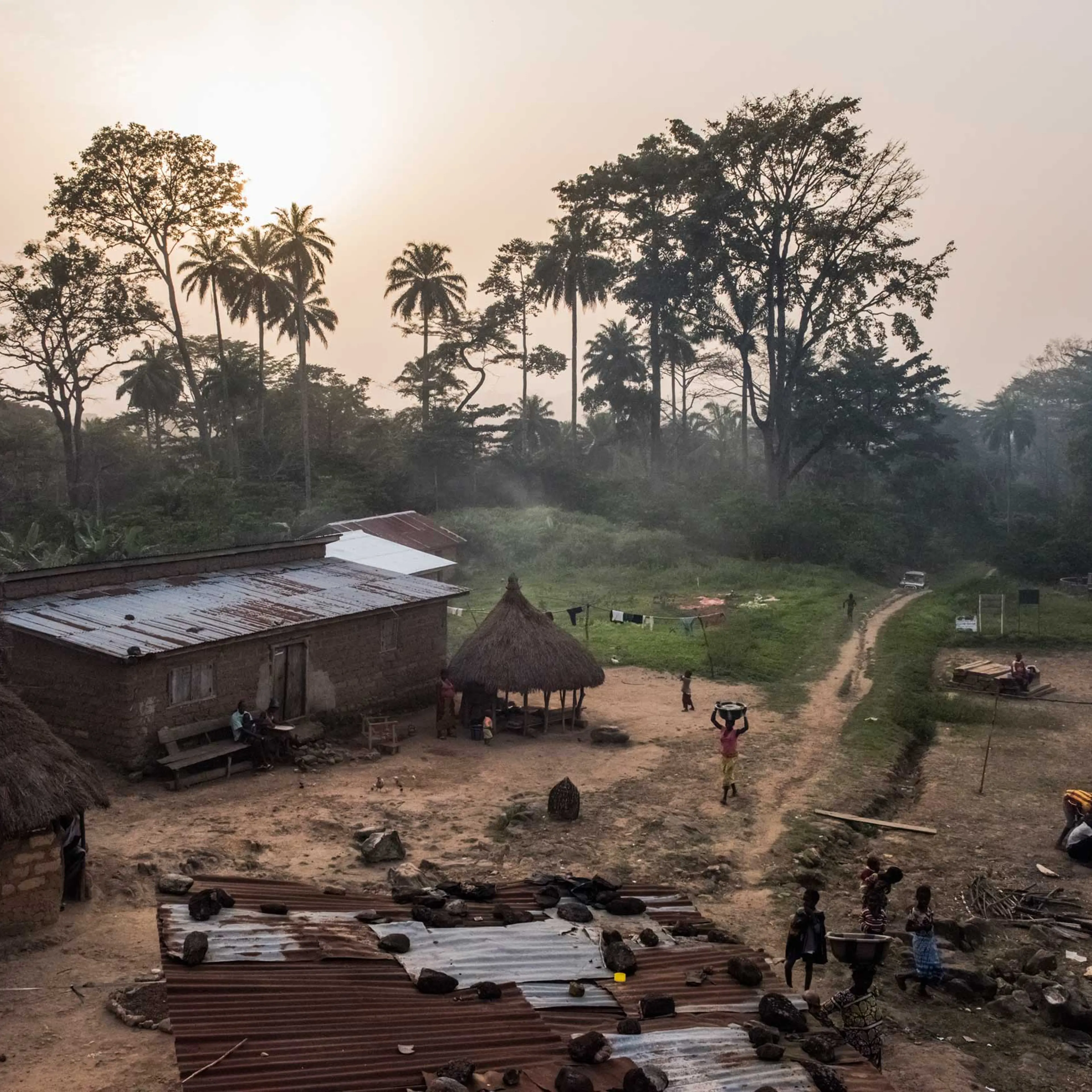 Residents set in for the evening in the village of Meliandou, Guinea, where a 1-year-old boy named Emile Ouamouno came down with symptoms consistent with Ebola and died in late December 2013.